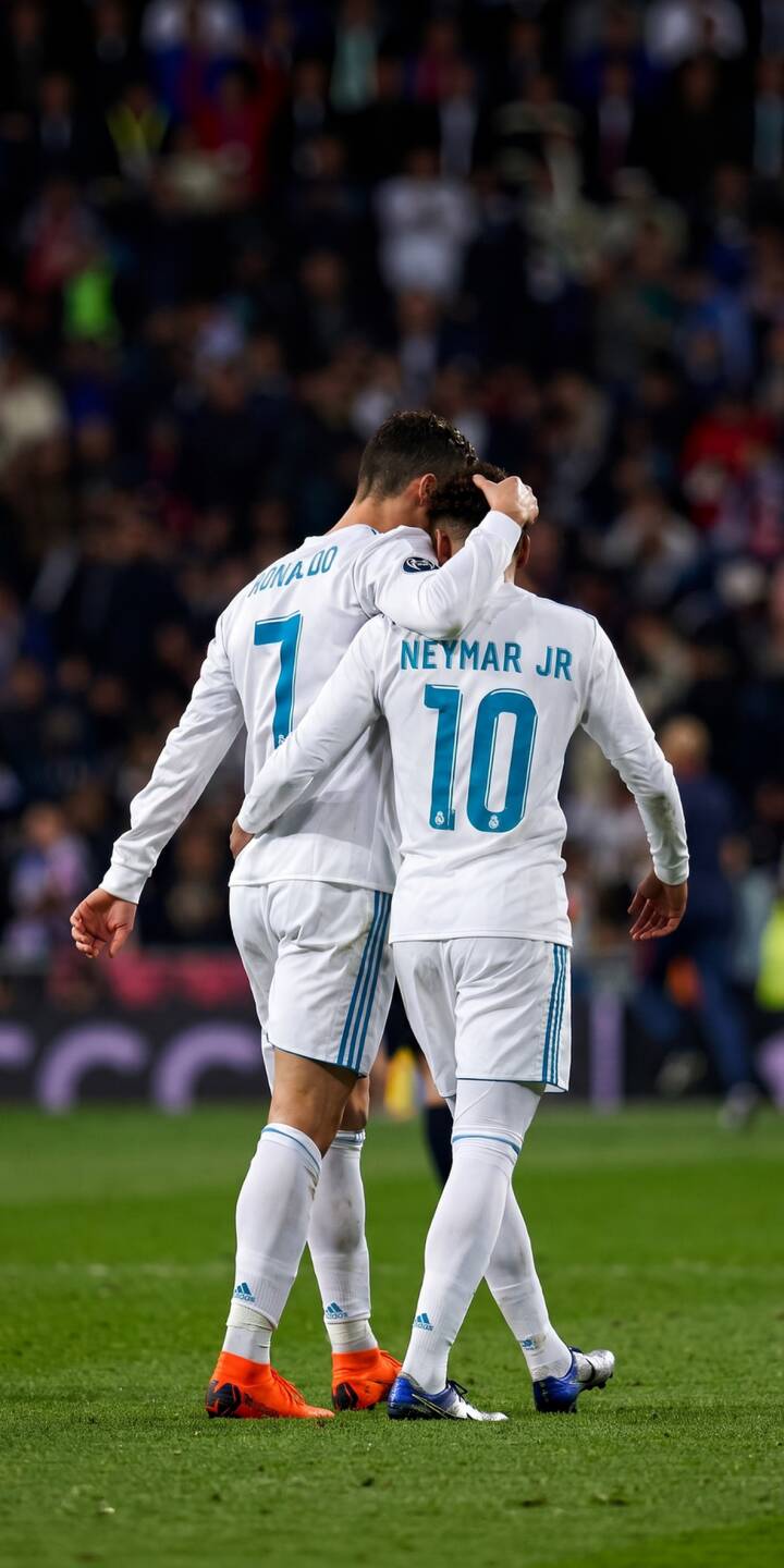 A heartfelt embrace between football legends Cristiano Ronaldo and Neymar Jr on the pitch creates a powerful scene in this stunning 4K wallpaper. This dynamic wallpaper, showcasing their iconic white jerseys and vibrant boots, is a must-have for any iPhone. | sports football iphone ronaldo soccer wallpaper neymar cristiano ronaldo mobile 4k wallpaper hd wallpaper neymar jr A heartfelt embrace between football legends Cristiano Ronaldo and Neymar Jr on the pitch creates a powerful scene in this stunning 4K wallpaper. This dynamic wallpaper, showcasing their iconic white jerseys and vibrant boots, is a must-have for any iPhone.