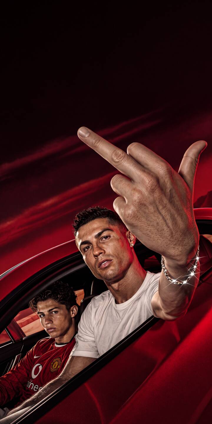 Cristiano Ronaldo makes a bold hand gesture, his silver bracelet catching the light, while a younger version of himself sits sternly in the sleek red car. This powerful 4K wallpaper perfectly captures his defiant attitude, making it a must-have wallpaper for iPhone users. | football iphone ronaldo wallpaper cr7 legend cristiano ronaldo mobile red car 4k wallpaper hd wallpaper attitude Cristiano Ronaldo makes a bold hand gesture, his silver bracelet catching the light, while a younger version of himself sits sternly in the sleek red car. This powerful 4K wallpaper perfectly captures his defiant attitude, making it a must-have wallpaper for iPhone users.