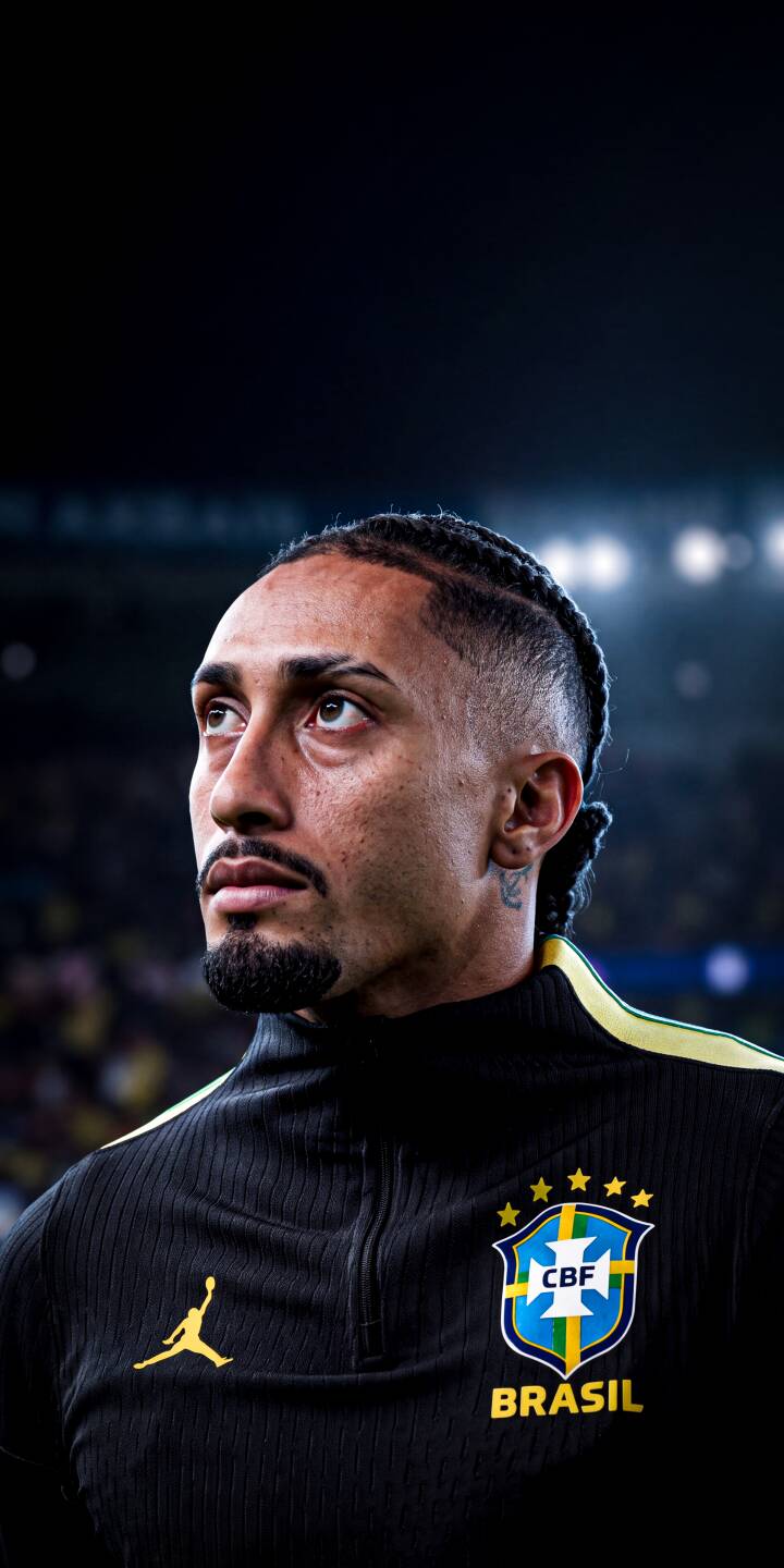 Raphinha's braided hairstyle and focused gaze are captured intently in his black Brazil training top, making for a striking 4K wallpaper. This dynamic football wallpaper is perfect for personalizing your iPhone. | sports stadium athlete iphone wallpaper raphinha mobile footballer 4k wallpaper hd wallpaper braids brazil football Raphinha's braided hairstyle and focused gaze are captured intently in his black Brazil training top, making for a striking 4K wallpaper. This dynamic football wallpaper is perfect for personalizing your iPhone.