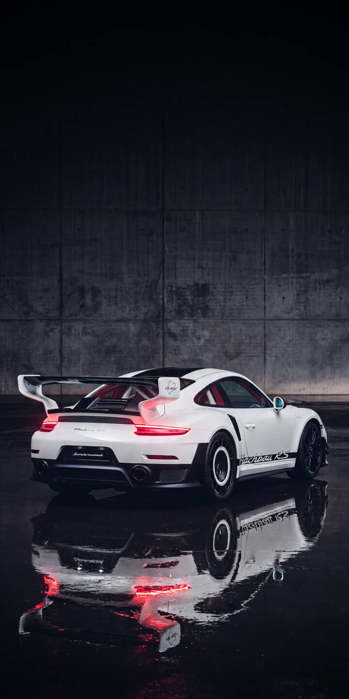 Glowing red taillights of the pristine white Porsche 911 GT3 RS reflect sharply on the wet dark ground in this stunning 4K wallpaper, making it an epic iPhone wallpaper for car enthusiasts. | sports car reflection iphone porsche wallpaper mobile porsche 911 white car gt3 rs 4k wallpaper hd wallpaper red lights Glowing red taillights of the pristine white Porsche 911 GT3 RS reflect sharply on the wet dark ground in this stunning 4K wallpaper, making it an epic iPhone wallpaper for car enthusiasts.