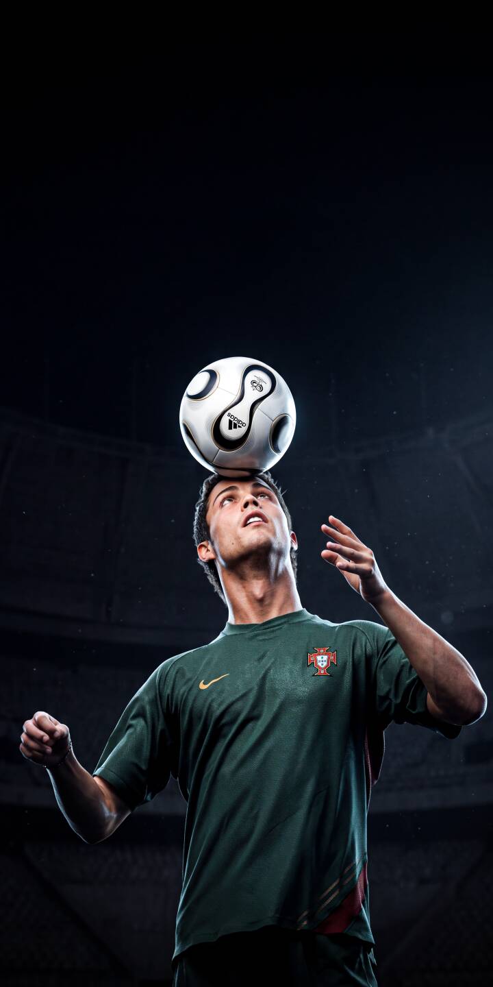 Cristiano Ronaldo perfectly balances a soccer ball on his head, his focused gaze intent on the skill, in this dynamic 4K wallpaper. This iconic moment from the football star makes an excellent wallpaper for iPhone users. | sports football iphone ronaldo soccer wallpaper portugal cristiano ronaldo mobile 4k wallpaper hd wallpaper skill Cristiano Ronaldo perfectly balances a soccer ball on his head, his focused gaze intent on the skill, in this dynamic 4K wallpaper. This iconic moment from the football star makes an excellent wallpaper for iPhone users.
