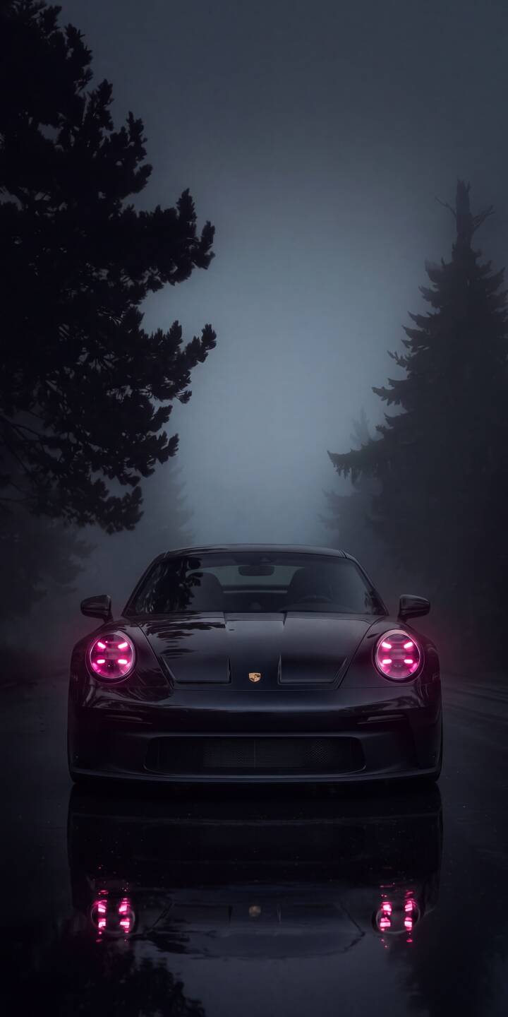 The Porsche's striking pink headlights cut through the dense fog, illuminating a dark forest road in this atmospheric 4K wallpaper. This captivating Porsche wallpaper, with its dramatic reflections on the wet ground, is perfect for iPhone users seeking a mysterious and elegant background. | car sports car dark iphone porsche wallpaper mobile porsche 911 4k wallpaper hd wallpaper misty pink lights The Porsche's striking pink headlights cut through the dense fog, illuminating a dark forest road in this atmospheric 4K wallpaper. This captivating Porsche wallpaper, with its dramatic reflections on the wet ground, is perfect for iPhone users seeking a mysterious and elegant background.