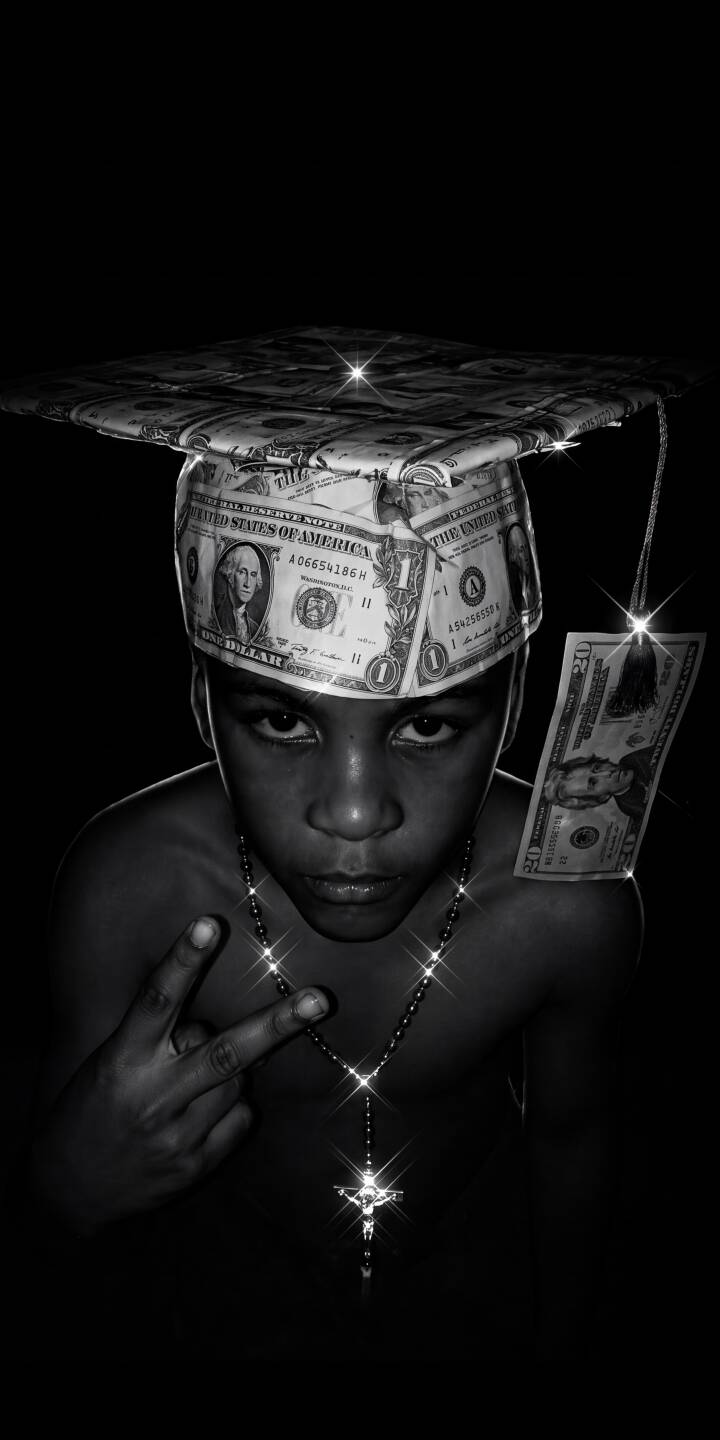 A determined young face wearing a unique graduation cap made of dollar bills catches the light, reflecting ambition and faith in this striking 4K wallpaper. This powerful monochrome wallpaper, featuring a sparkling rosary and confident gesture, is perfect for iPhone customization. | aesthetic rosary money iphone wallpaper black and white mobile 4k wallpaper hd wallpaper youth inspirational graduation A determined young face wearing a unique graduation cap made of dollar bills catches the light, reflecting ambition and faith in this striking 4K wallpaper. This powerful monochrome wallpaper, featuring a sparkling rosary and confident gesture, is perfect for iPhone customization.