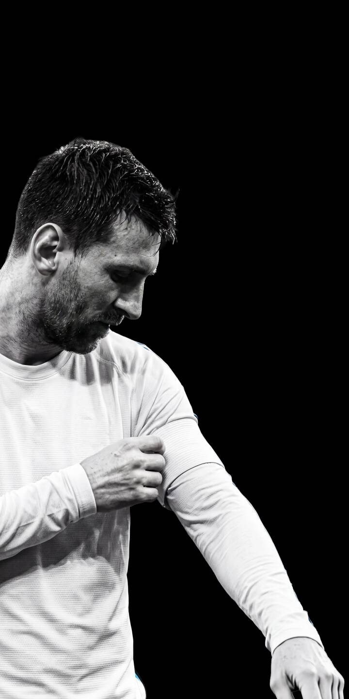 In a striking black and white portrait, Lionel Messi intently rolls up his sleeve, exuding focus and readiness in this captivating 4K wallpaper — an essential wallpaper for iPhone showcasing the legendary athlete. | sports football iphone messi minimalist soccer wallpaper black and white lionel messi mobile 4k wallpaper hd wallpaper In a striking black and white portrait, Lionel Messi intently rolls up his sleeve, exuding focus and readiness in this captivating 4K wallpaper — an essential wallpaper for iPhone showcasing the legendary athlete.