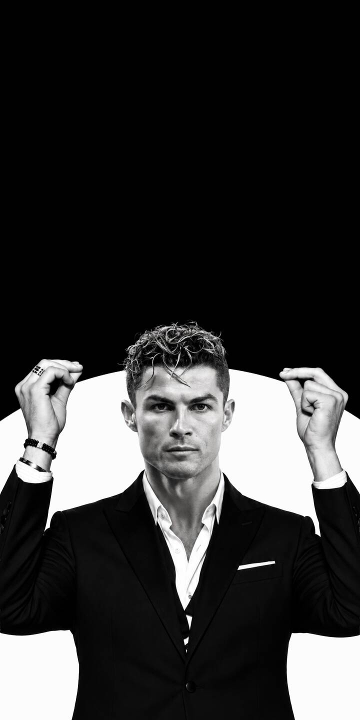 Cristiano Ronaldo's intense gaze dominates this stark black and white 4K wallpaper, featuring the iconic footballer in a sharp suit with hands posed dramatically against a graphic background. This sophisticated wallpaper for iPhone fans perfectly captures his focused presence. | football iphone ronaldo minimalist soccer wallpaper black and white cristiano ronaldo mobile 4k wallpaper hd wallpaper formal suit Cristiano Ronaldo's intense gaze dominates this stark black and white 4K wallpaper, featuring the iconic footballer in a sharp suit with hands posed dramatically against a graphic background. This sophisticated wallpaper for iPhone fans perfectly captures his focused presence.