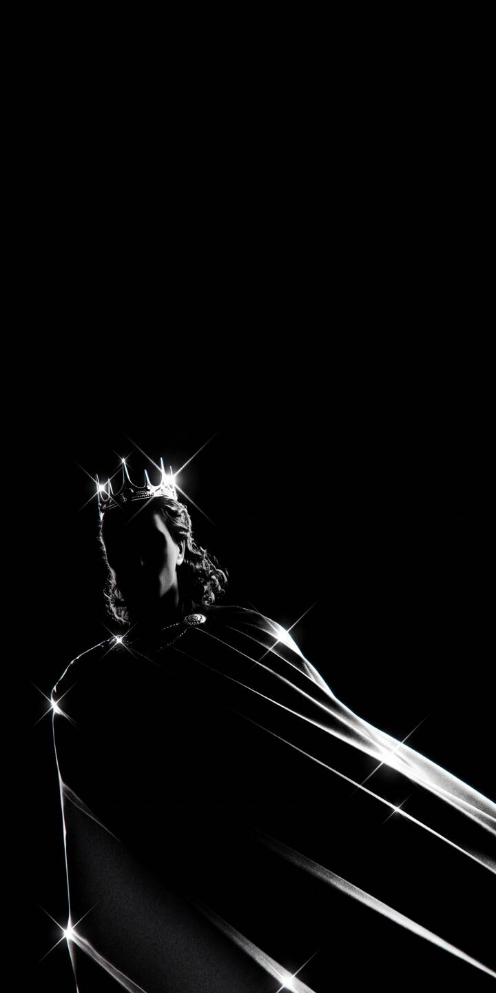 Intense light glimmers from a shining crown and flowing, light-streaked cape worn by a silhouetted figure in this dramatic black and white 4K wallpaper, making an elegant statement for your iPhone. | aesthetic dark crown king iphone wallpaper mobile 4k wallpaper hd wallpaper monochrome regal sparkle Intense light glimmers from a shining crown and flowing, light-streaked cape worn by a silhouetted figure in this dramatic black and white 4K wallpaper, making an elegant statement for your iPhone.