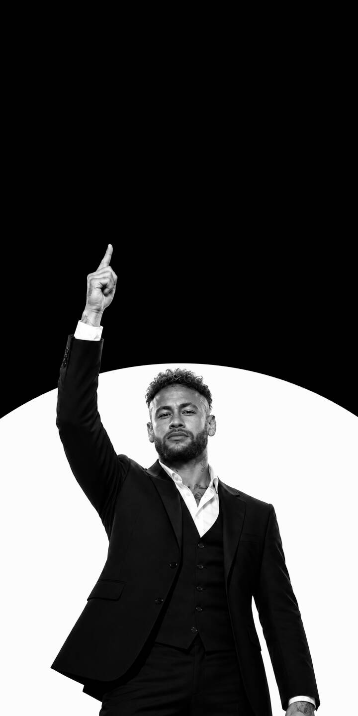 Neymar Jr.'s intense gaze and confident upward pointing gesture dominate this striking monochromatic 4K wallpaper. Dressed in a sharp black suit against an abstract split background, it's a perfect sophisticated wallpaper for your iPhone. | suit iphone soccer wallpaper black and white neymar mobile footballer 4k wallpaper hd wallpaper monochromatic neymar jr Neymar Jr.'s intense gaze and confident upward pointing gesture dominate this striking monochromatic 4K wallpaper. Dressed in a sharp black suit against an abstract split background, it's a perfect sophisticated wallpaper for your iPhone.