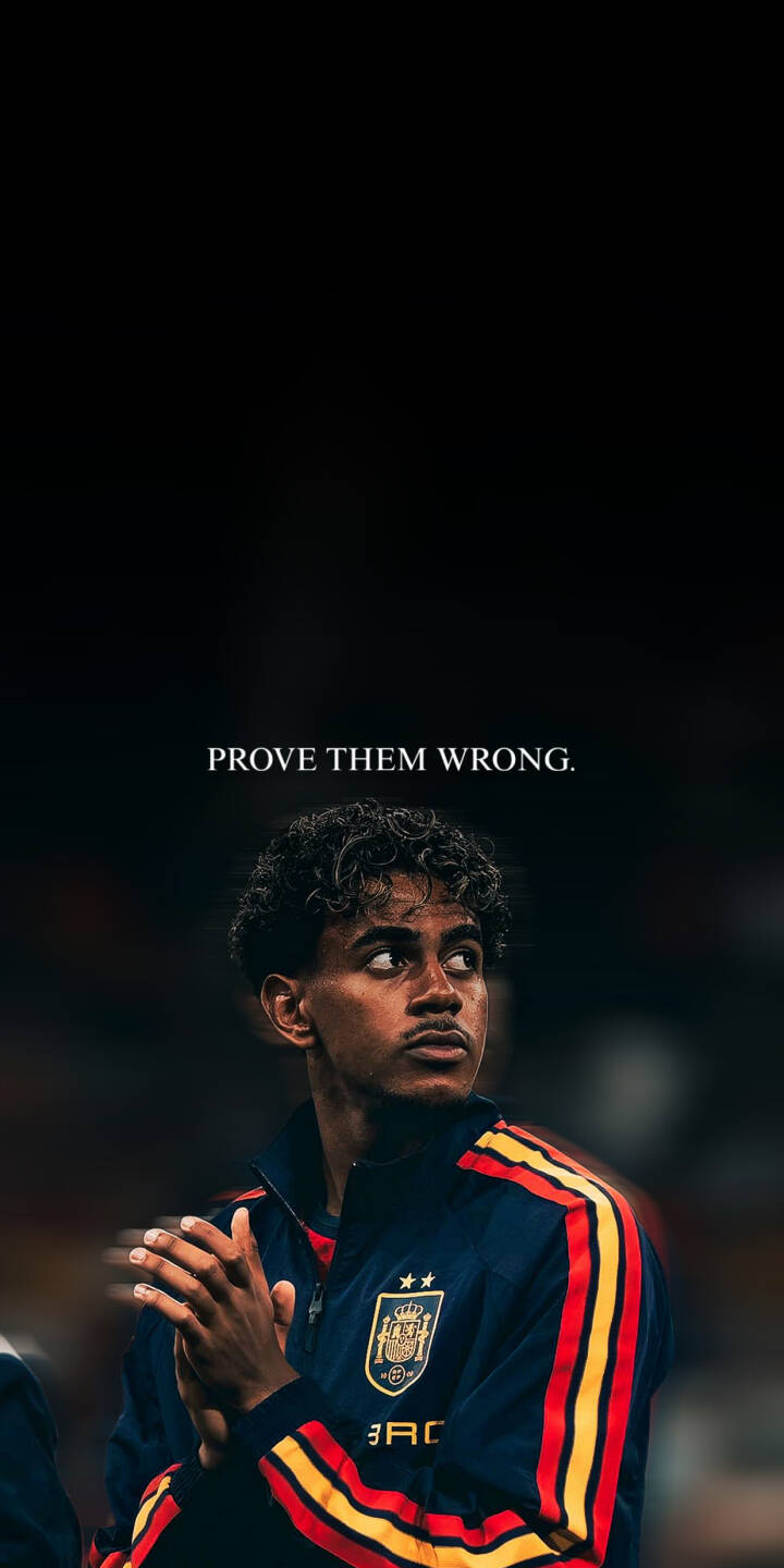 The powerful message "PROVE THEM WRONG." floats above a determined young Spanish footballer, his hands clasped as he gazes thoughtfully, creating an inspiring 4K wallpaper perfect for iPhone. | football aesthetic dark quote motivation iphone soccer spain wallpaper mobile 4k wallpaper hd wallpaper The powerful message "PROVE THEM WRONG." floats above a determined young Spanish footballer, his hands clasped as he gazes thoughtfully, creating an inspiring 4K wallpaper perfect for iPhone.