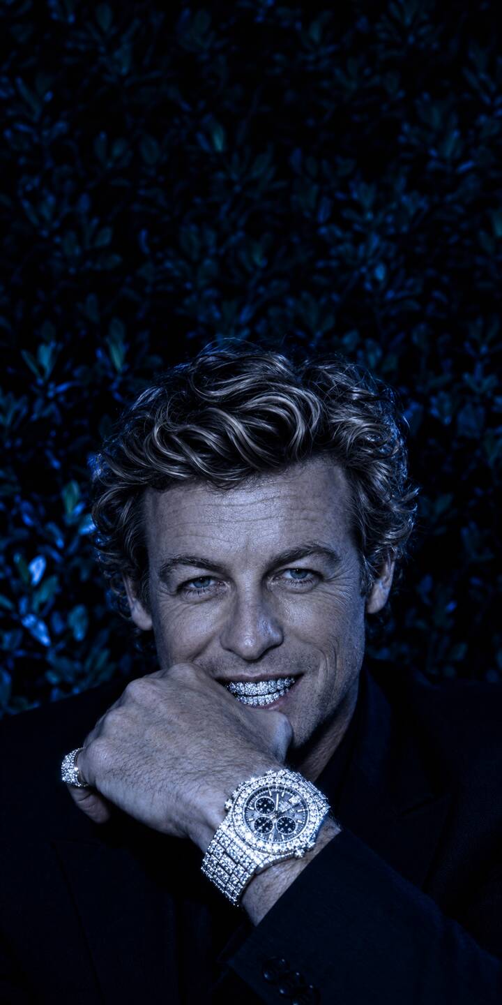 Dazzling diamond grillz flash from Simon Baker's smile, complemented by a brilliant iced-out watch, making this 4K wallpaper a truly luxurious statement. This striking wallpaper is a perfect download for any iPhone looking for a touch of refined elegance. | iphone luxury wallpaper grillz mobile hollywood celebrity 4k wallpaper hd wallpaper diamond watch simon baker mentalist Dazzling diamond grillz flash from Simon Baker's smile, complemented by a brilliant iced-out watch, making this 4K wallpaper a truly luxurious statement. This striking wallpaper is a perfect download for any iPhone looking for a touch of refined elegance.