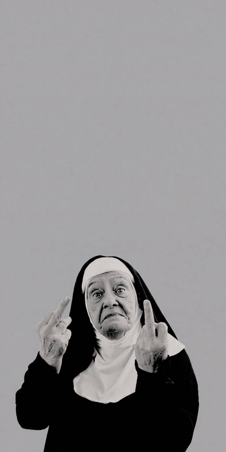 An elderly nun defiantly displays both middle fingers with a direct, expressive gaze in this striking grayscale 4K wallpaper. This irreverent and unique wallpaper is perfect for personalizing your iPhone. | funny nun iphone wallpaper grayscale mobile 4k wallpaper hd wallpaper satire middle finger irreverent old nun An elderly nun defiantly displays both middle fingers with a direct, expressive gaze in this striking grayscale 4K wallpaper. This irreverent and unique wallpaper is perfect for personalizing your iPhone.