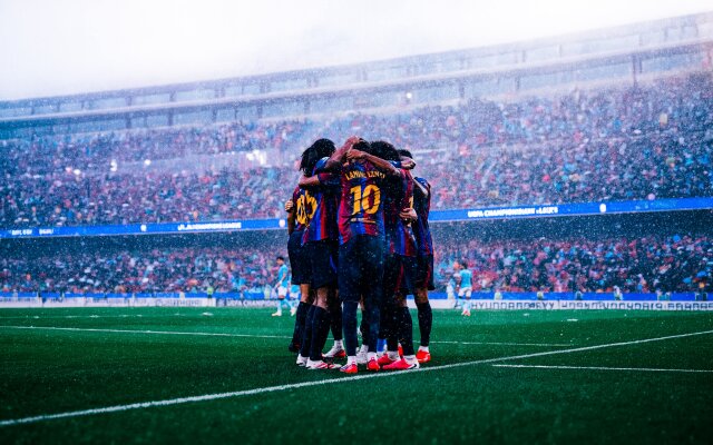 Rain pours down on the triumphant FC Barcelona football team as they huddle on the vibrant green pitch, making this 4K MacOS wallpaper a dynamic celebration of victory amidst the cheering stadium crowd. This stunning sports wallpaper perfectly captures the raw emotion and team spirit. | sports stadium football team rainy celebration wallpaper macos fc barcelona 4k wallpaper hd wallpaper macbook imac Rain pours down on the triumphant FC Barcelona football team as they huddle on the vibrant green pitch, making this 4K MacOS wallpaper a dynamic celebration of victory amidst the cheering stadium crowd. This stunning sports wallpaper perfectly captures the raw emotion and team spirit.