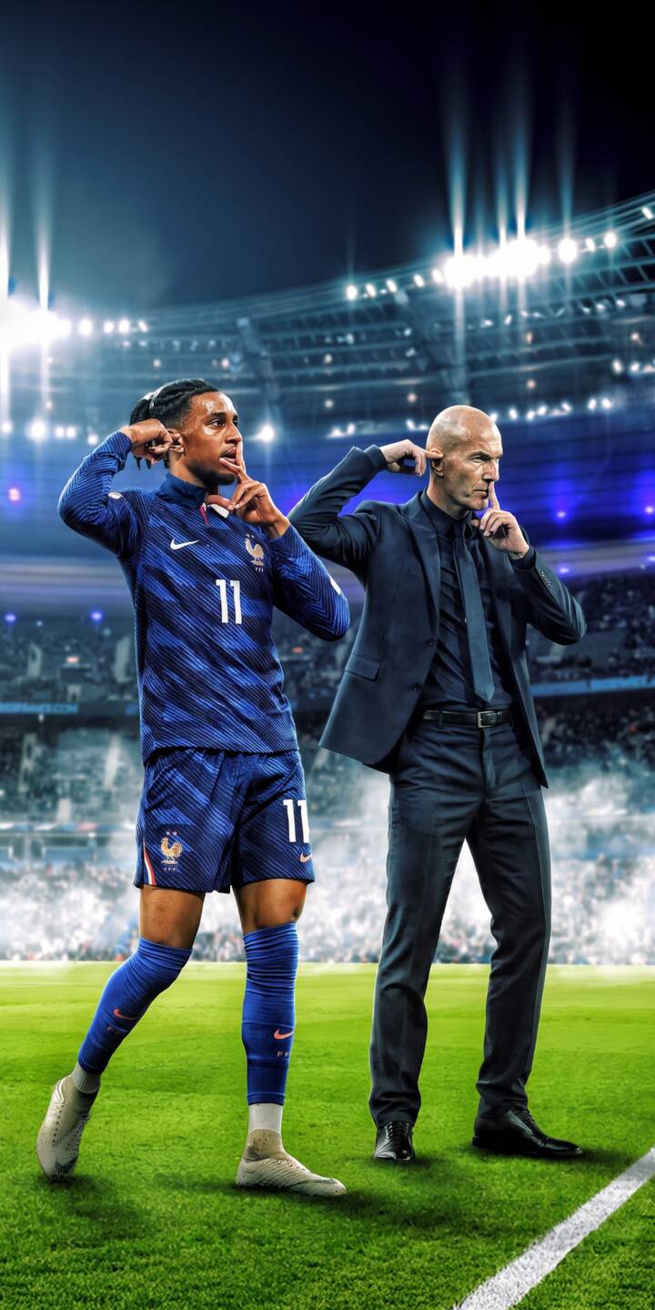 Zinedine Zidane and French player Christopher Nkunku strike identical 'shush' and ear-cupping poses on a vibrant green stadium pitch in this electrifying 4K wallpaper. This dynamic sports wallpaper, featuring the iconic duo under bright stadium lights, makes an exceptional iPhone background. | sports football stadium iphone soccer wallpaper mobile 4k wallpaper hd wallpaper france team zinedine zidane christopher nkunku Zinedine Zidane and French player Christopher Nkunku strike identical 'shush' and ear-cupping poses on a vibrant green stadium pitch in this electrifying 4K wallpaper. This dynamic sports wallpaper, featuring the iconic duo under bright stadium lights, makes an exceptional iPhone background.