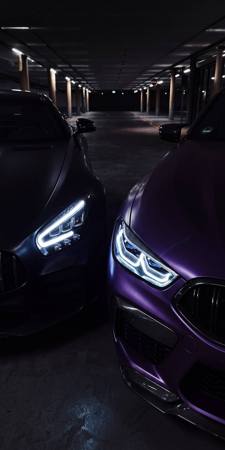 The brilliant LED headlights of a matte purple sportscar and its dark counterpart cut through the gloom of an underground parking garage. This stunning 4K automotive wallpaper, featuring sleek carbon fiber details, is an essential aesthetic wallpaper for any iPhone. | aesthetic dark parking garage iphone wallpaper cars mobile 4k wallpaper hd wallpaper automotive luxury cars sports cars The brilliant LED headlights of a matte purple sportscar and its dark counterpart cut through the gloom of an underground parking garage. This stunning 4K automotive wallpaper, featuring sleek carbon fiber details, is an essential aesthetic wallpaper for any iPhone.