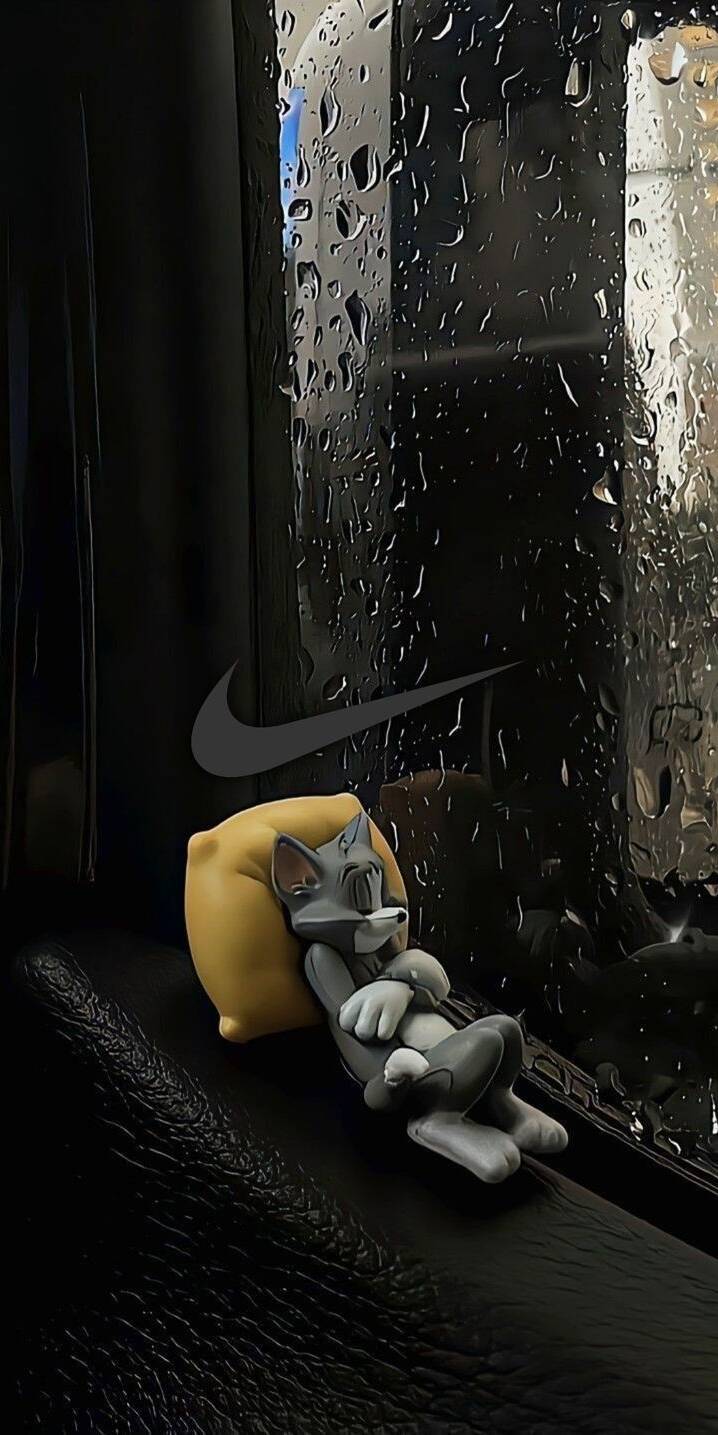 Raindrops stream down the dark window, creating a tranquil backdrop for the sleeping Tom figurine nestled on a yellow pillow in this charming 4K wallpaper. This delightful wallpaper is perfect for any iPhone, adding a touch of cozy serenity to your device. | tome Raindrops stream down the dark window, creating a tranquil backdrop for the sleeping Tom figurine nestled on a yellow pillow in this charming 4K wallpaper. This delightful wallpaper is perfect for any iPhone, adding a touch of cozy serenity to your device.