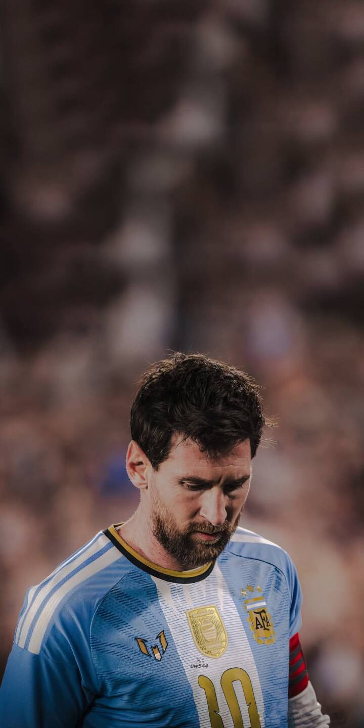 Lionel Messi's contemplative gaze and iconic Argentina blue jersey are beautifully captured in this striking 4K wallpaper. This stunning wallpaper for iPhone features detailed gold emblems and his signature number 10. | sports football athlete iphone messi argentina soccer wallpaper lionel messi mobile 4k wallpaper hd wallpaper Lionel Messi's contemplative gaze and iconic Argentina blue jersey are beautifully captured in this striking 4K wallpaper. This stunning wallpaper for iPhone features detailed gold emblems and his signature number 10.