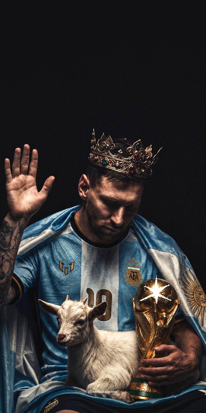 Messi crowned as football’s GOAT, holding the World Cup alongside the iconic lamb in a powerful tribute to his legendary career and Argentina legacy. | football king iphone messi argentina wallpaper goat lionel messi mobile 4k wallpaper hd wallpaper world cup Messi crowned as football’s GOAT, holding the World Cup alongside the iconic lamb in a powerful tribute to his legendary career and Argentina legacy.