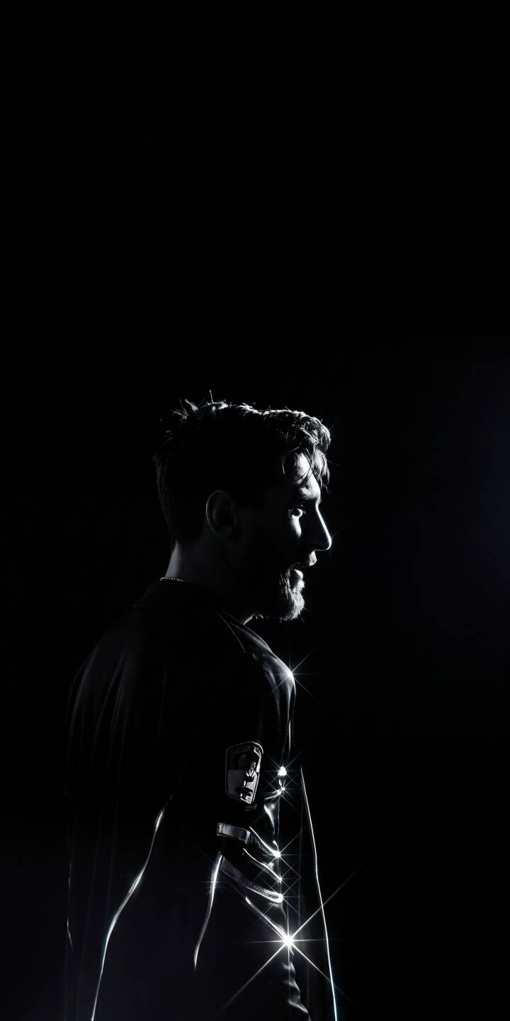 Intense rim lighting sharply defines Messi's profile against a pure black background in this stunning 4K wallpaper, making it a perfect dark wallpaper for iPhone. Glistening starbursts add an intriguing touch to his uniform. | aesthetic man dark profile iphone minimalist wallpaper black and white mobile 4k wallpaper hd wallpaper high contrast Intense rim lighting sharply defines Messi's profile against a pure black background in this stunning 4K wallpaper, making it a perfect dark wallpaper for iPhone. Glistening starbursts add an intriguing touch to his uniform.