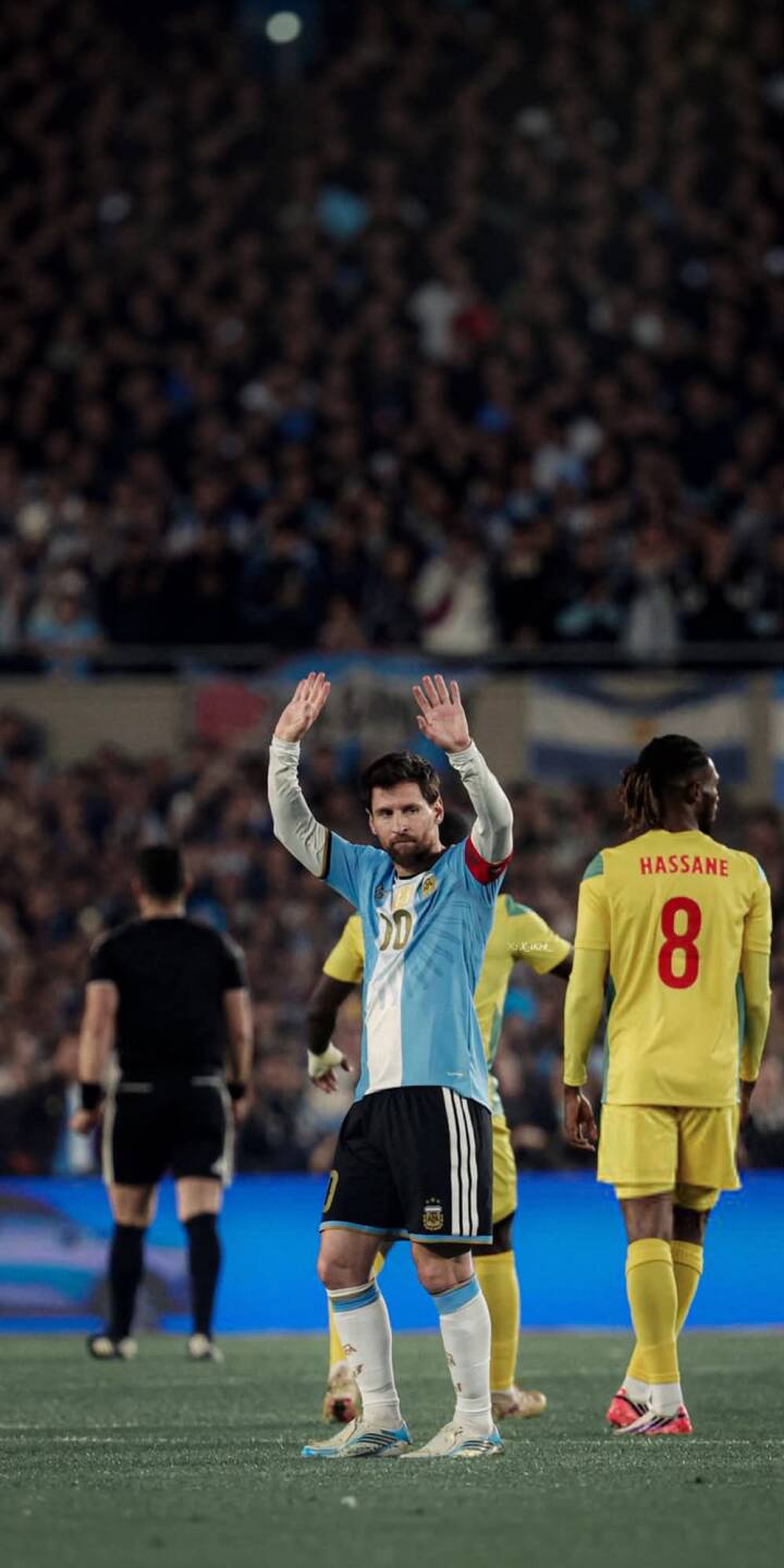 Lionel Messi raises both hands to wave at the cheering crowd, an iconic moment captured in this stunning 4K wallpaper. Wearing his Argentina kit, this powerful soccer wallpaper is perfect for any iPhone user and fan of the legendary player. | sports football stadium iphone messi argentina soccer wallpaper lionel messi mobile 4k wallpaper hd wallpaper Lionel Messi raises both hands to wave at the cheering crowd, an iconic moment captured in this stunning 4K wallpaper. Wearing his Argentina kit, this powerful soccer wallpaper is perfect for any iPhone user and fan of the legendary player.