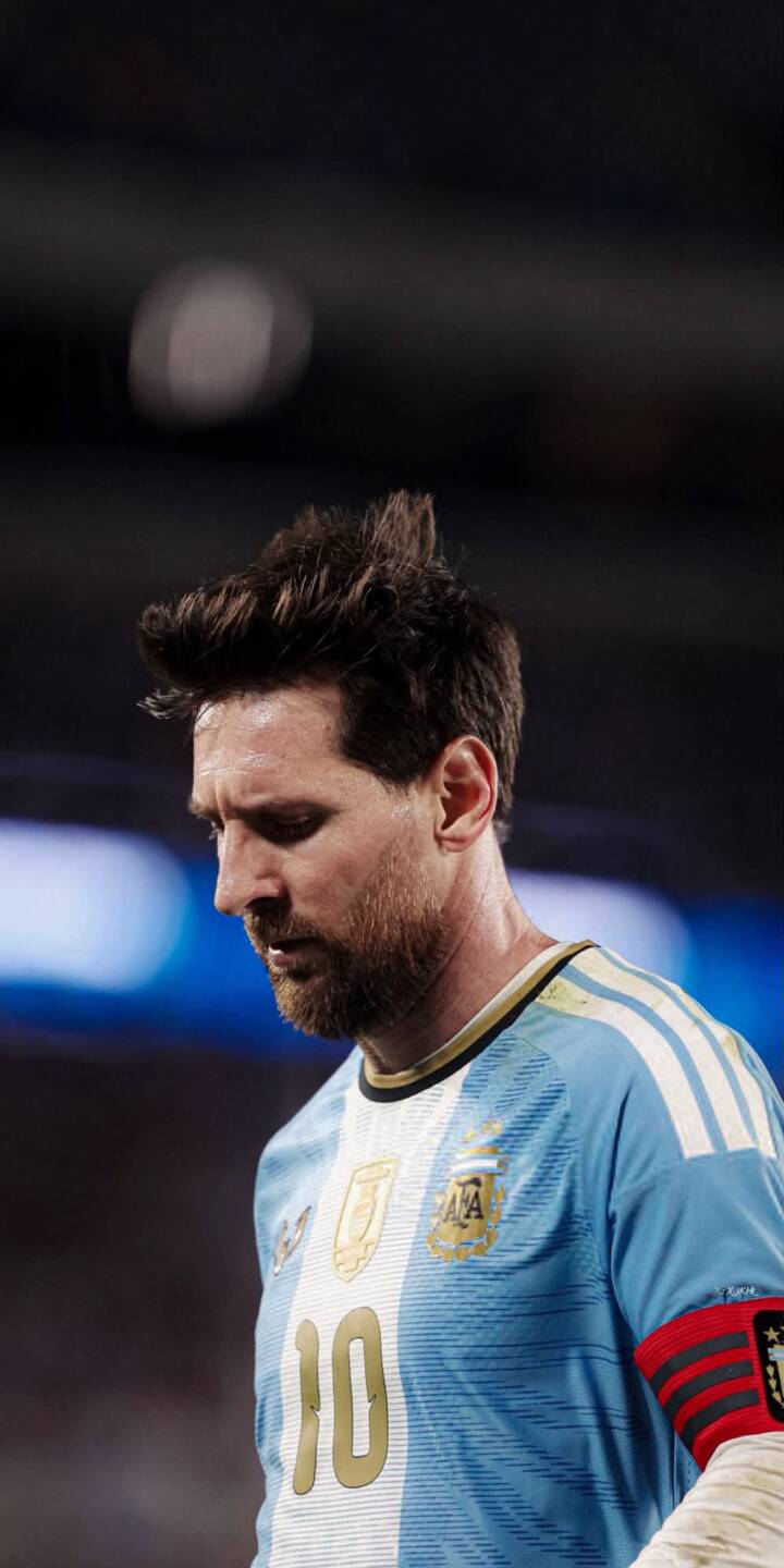 Lionel Messi's pensive gaze, reflecting focus and intensity, is expertly captured in this 4K wallpaper, highlighting his iconic number 10 Argentina jersey. This compelling wallpaper for iPhone users also features his distinct captain's armband. | sports football athlete iphone messi argentina soccer wallpaper lionel messi mobile 4k wallpaper hd wallpaper Lionel Messi's pensive gaze, reflecting focus and intensity, is expertly captured in this 4K wallpaper, highlighting his iconic number 10 Argentina jersey. This compelling wallpaper for iPhone users also features his distinct captain's armband.