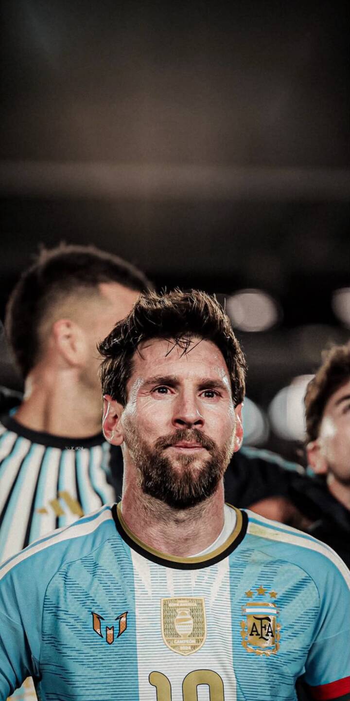 Messi's intense, focused gaze captures a moment of iconic reflection as he stands in his light blue and white Argentina jersey in this stunning 4K wallpaper - an essential iPhone wallpaper for football enthusiasts. | football portrait iphone messi argentina soccer wallpaper legend lionel messi mobile 4k wallpaper hd wallpaper Messi's intense, focused gaze captures a moment of iconic reflection as he stands in his light blue and white Argentina jersey in this stunning 4K wallpaper - an essential iPhone wallpaper for football enthusiasts.