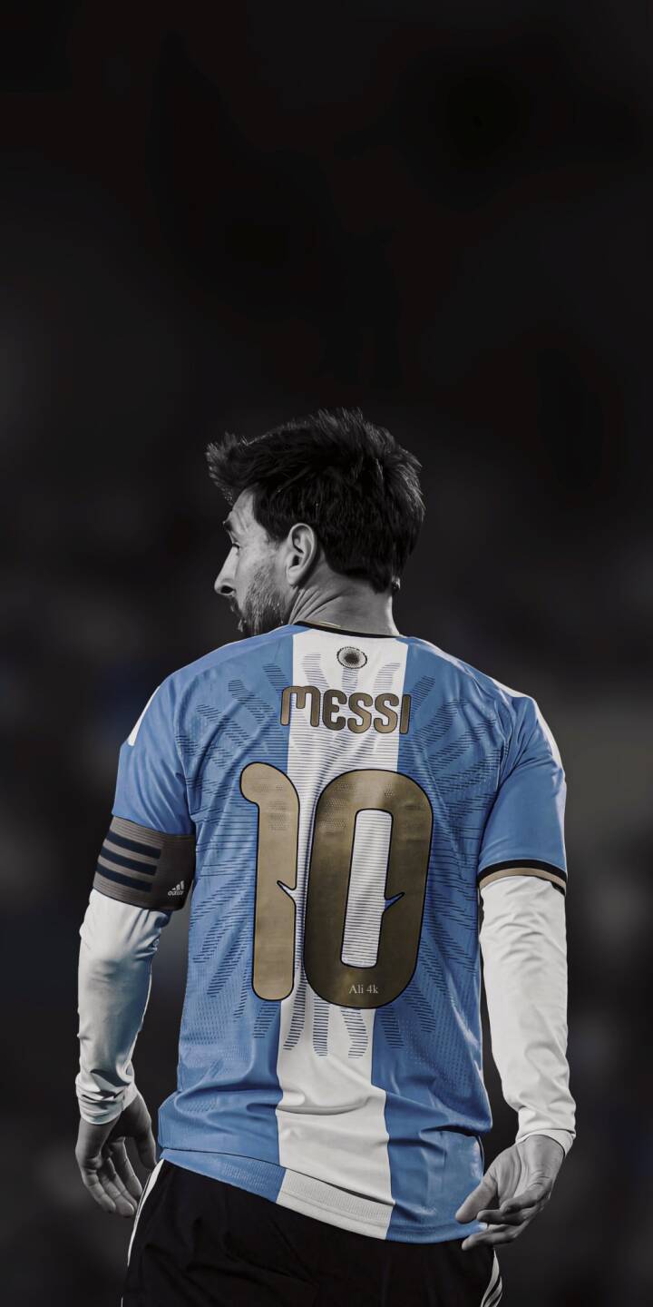Lionel Messi, wearing his iconic number 10 Argentina jersey, gazes over his shoulder with a determined look in this captivating 4K wallpaper -- a must-have wallpaper for any iPhone fan looking to show their passion for football. | football iphone messi argentina wallpaper jersey sport lionel messi mobile 4k wallpaper hd wallpaper iconic Lionel Messi, wearing his iconic number 10 Argentina jersey, gazes over his shoulder with a determined look in this captivating 4K wallpaper -- a must-have wallpaper for any iPhone fan looking to show their passion for football.