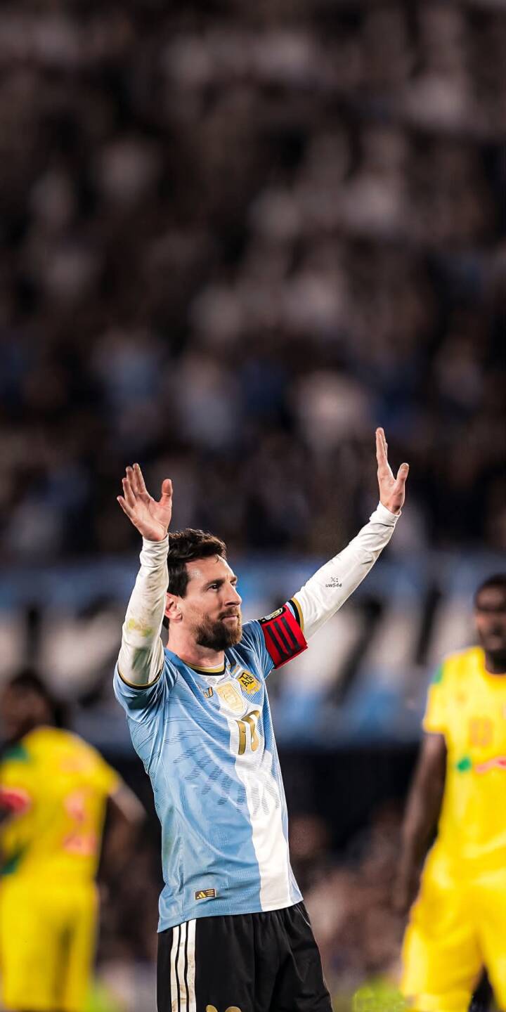 Messi lifts his hands in a triumphant gesture, clad in his iconic Argentina jersey, creating a stunning 4K wallpaper perfect for your iPhone. This dynamic football wallpaper captures the legendary player in a moment of adulation. | sports football stadium iphone messi argentina soccer wallpaper lionel messi mobile 4k wallpaper hd wallpaper Messi lifts his hands in a triumphant gesture, clad in his iconic Argentina jersey, creating a stunning 4K wallpaper perfect for your iPhone. This dynamic football wallpaper captures the legendary player in a moment of adulation.