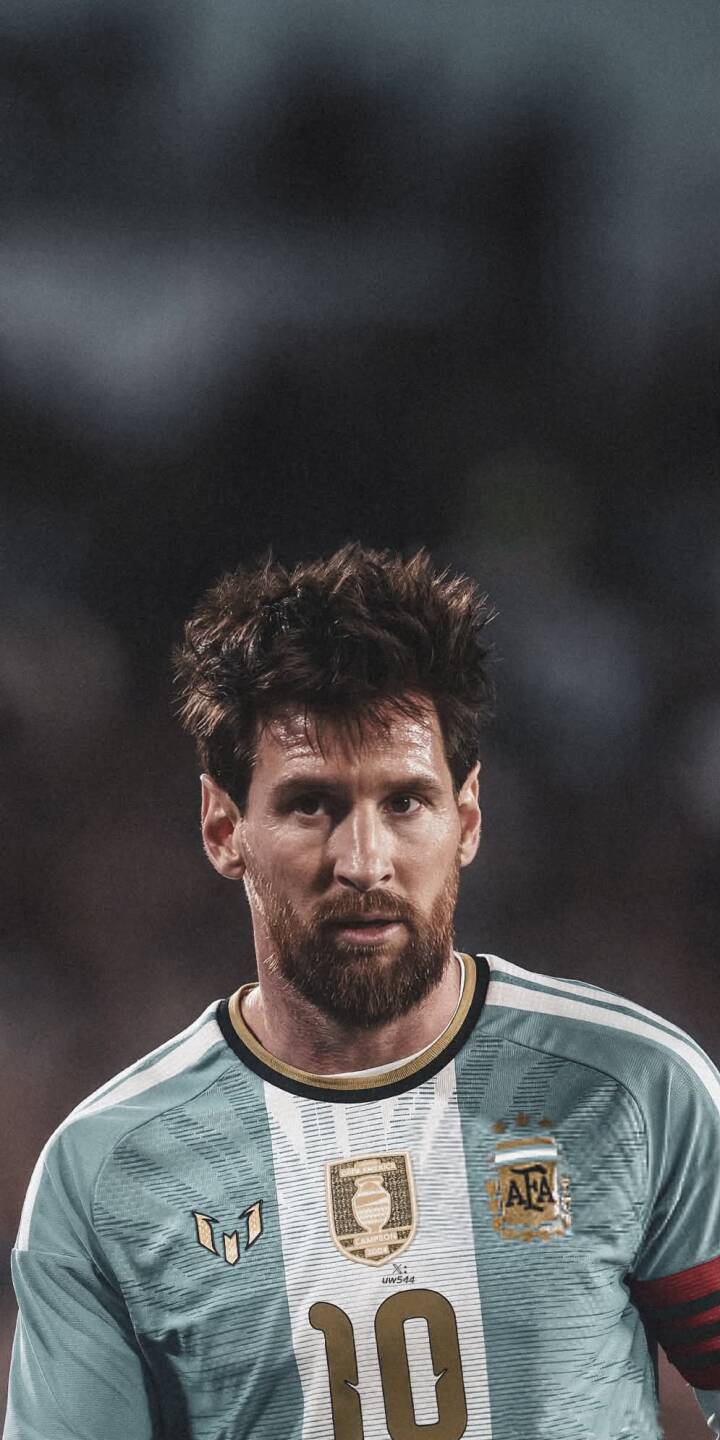 Messi's intense, focused gaze fills this compelling 4K wallpaper, prominently featuring his iconic number 10 Argentina jersey and distinctive beard. This striking wallpaper is perfect for iPhone users and fans of the football legend. | football iphone messi argentina soccer wallpaper goat jersey lionel messi mobile 4k wallpaper hd wallpaper Messi's intense, focused gaze fills this compelling 4K wallpaper, prominently featuring his iconic number 10 Argentina jersey and distinctive beard. This striking wallpaper is perfect for iPhone users and fans of the football legend.