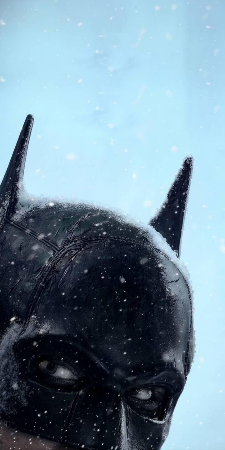 Fine flakes of snow settle softly on Batman's cowl and ears, creating a stark contrast against the cold blue sky in this striking 4K wallpaper. This intense visual makes it an essential wallpaper for iPhone users who love the Dark Knight. | vengeance thebatman batmanwallpaper daekknight robertpattinson Fine flakes of snow settle softly on Batman's cowl and ears, creating a stark contrast against the cold blue sky in this striking 4K wallpaper. This intense visual makes it an essential wallpaper for iPhone users who love the Dark Knight.