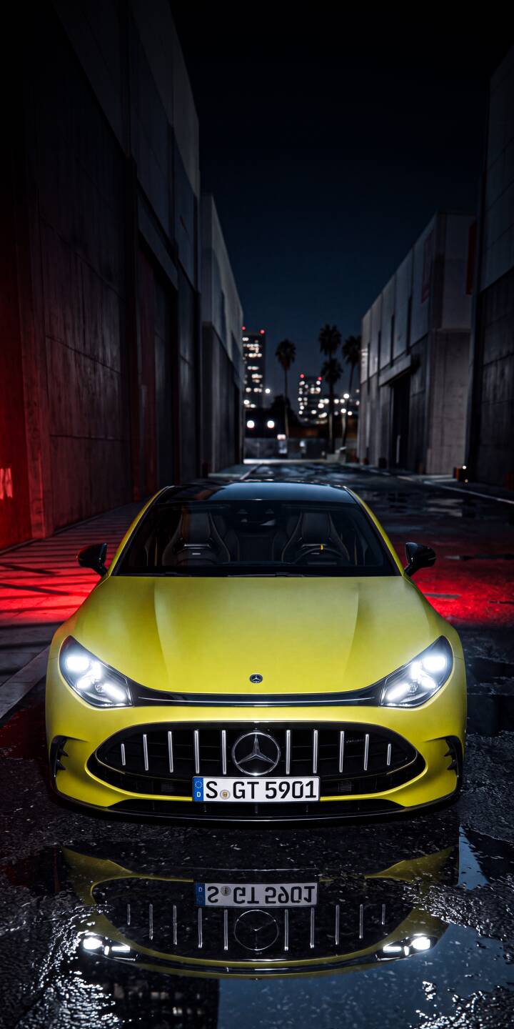 A gleaming yellow Mercedes-AMG GT stands powerfully in a dark, wet urban alley, its bright headlights and crisp reflection contrasting with the red glow on the wall and distant city lights, making this a stunning 4K wallpaper for iPhone. This premium vehicle wallpaper brings a dynamic street aesthetic to your mobile device. | sports car urban yellow night reflection iphone mercedes wallpaper mobile amg gt 4k wallpaper hd wallpaper A gleaming yellow Mercedes-AMG GT stands powerfully in a dark, wet urban alley, its bright headlights and crisp reflection contrasting with the red glow on the wall and distant city lights, making this a stunning 4K wallpaper for iPhone. This premium vehicle wallpaper brings a dynamic street aesthetic to your mobile device.