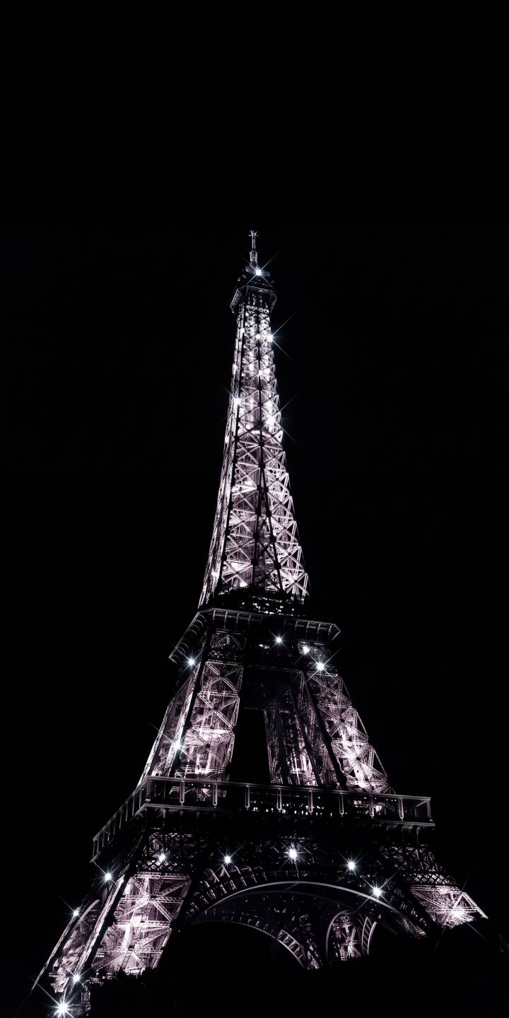 Sparkling purple lights illuminate the Eiffel Tower against a deep black sky in this captivating 4K wallpaper, making it a perfect dark aesthetic wallpaper for iPhone screens. This iconic landmark wallpaper truly shines, showcasing its intricate lattice work with a glittering effect. | aesthetic night landmark iphone paris wallpaper mobile 4k wallpaper hd wallpaper cityscape eiffel tower sparkle Sparkling purple lights illuminate the Eiffel Tower against a deep black sky in this captivating 4K wallpaper, making it a perfect dark aesthetic wallpaper for iPhone screens. This iconic landmark wallpaper truly shines, showcasing its intricate lattice work with a glittering effect.