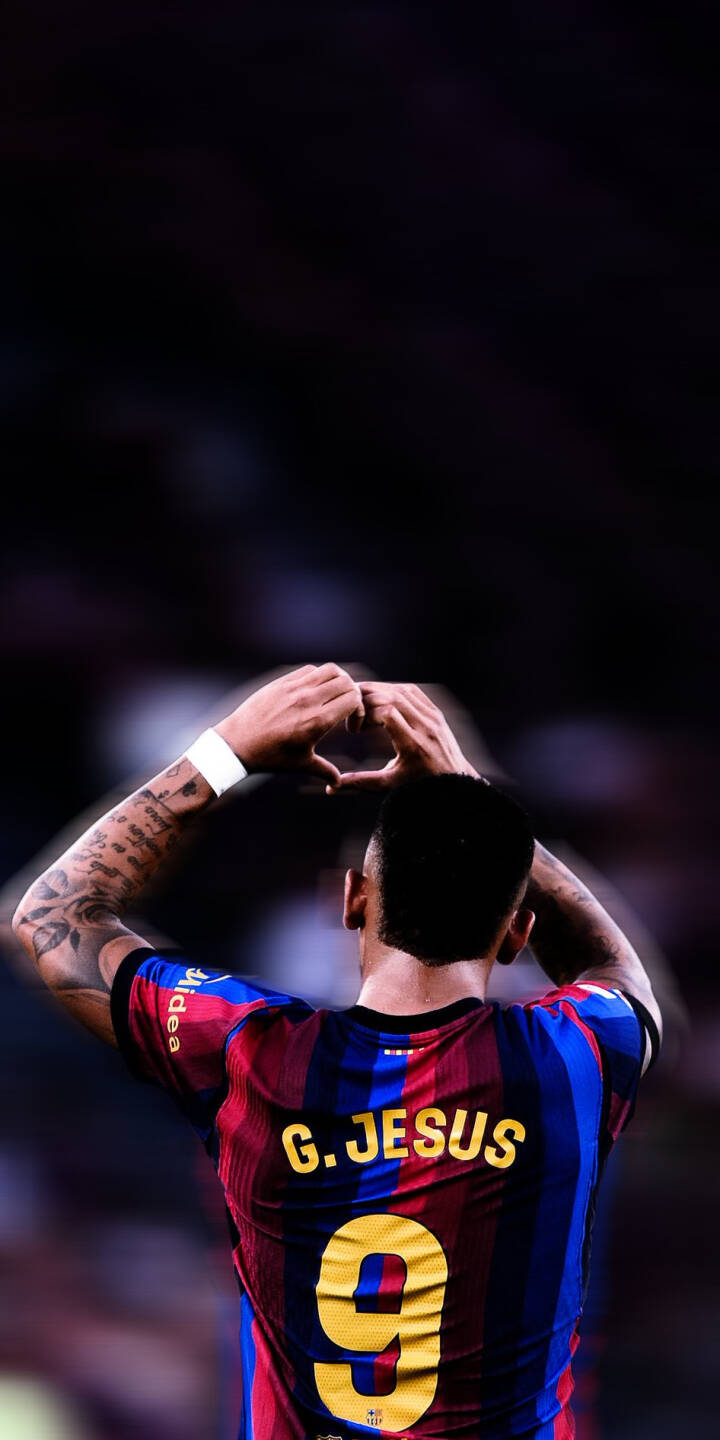 Gabriel Jesus forms a touching heart gesture with tattooed arms raised, showcasing his number 9 and iconic striped jersey in this striking 4K football wallpaper - an essential wallpaper for iPhone fans to celebrate their favorite striker. | sports football athlete iphone soccer wallpaper mobile 4k wallpaper hd wallpaper gabriel jesus heart gesture g jesus Gabriel Jesus forms a touching heart gesture with tattooed arms raised, showcasing his number 9 and iconic striped jersey in this striking 4K football wallpaper - an essential wallpaper for iPhone fans to celebrate their favorite striker.