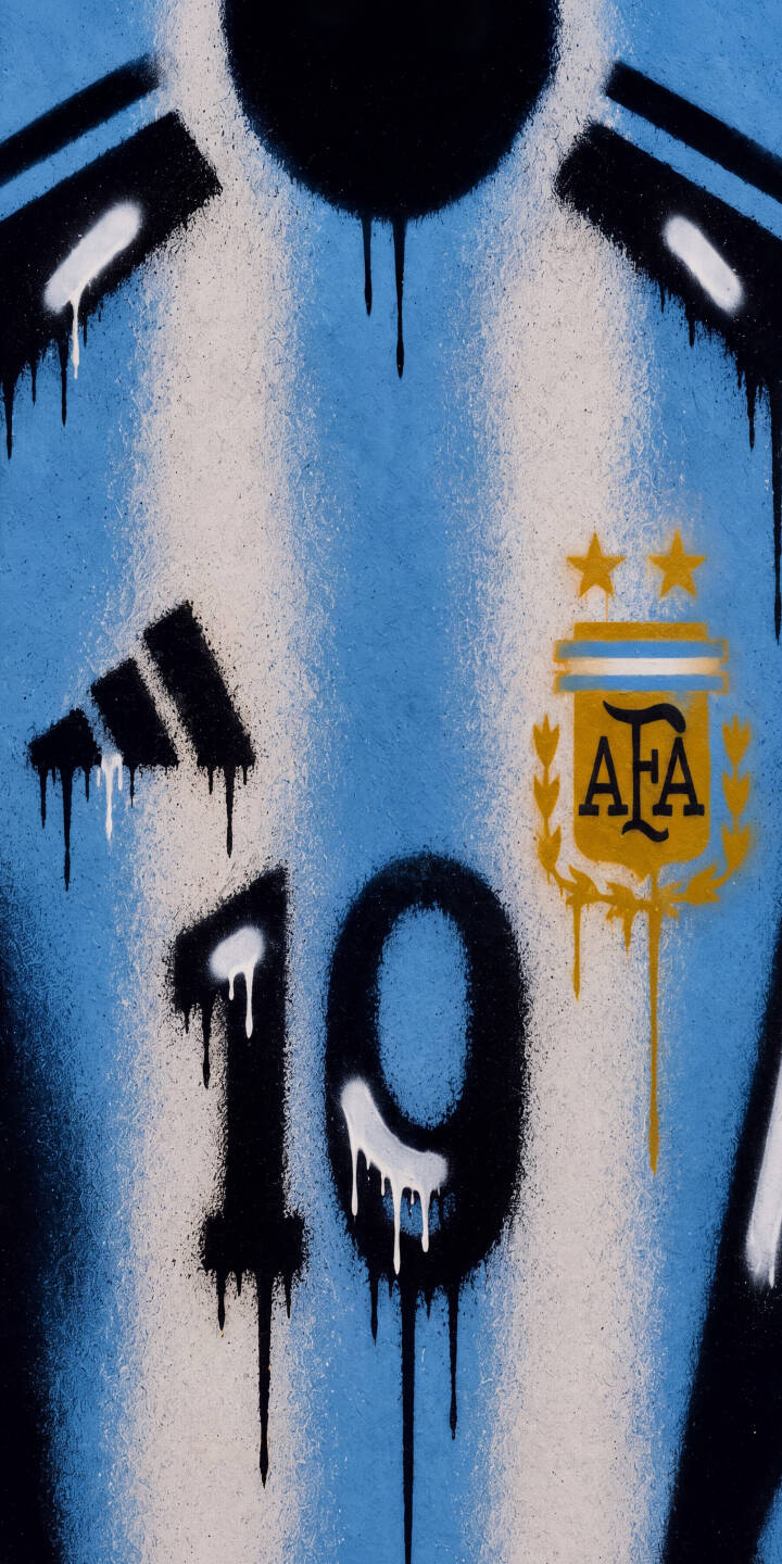 Bold black and white paint drips run down the stylized '10' and adidas logo on this dynamic graffiti Argentina 4K wallpaper. This iconic blue and white jersey design makes a striking wallpaper for iPhone users. | football street art iphone messi argentina wallpaper jersey graffiti mobile 4k wallpaper hd wallpaper number 10 Bold black and white paint drips run down the stylized '10' and adidas logo on this dynamic graffiti Argentina 4K wallpaper. This iconic blue and white jersey design makes a striking wallpaper for iPhone users.