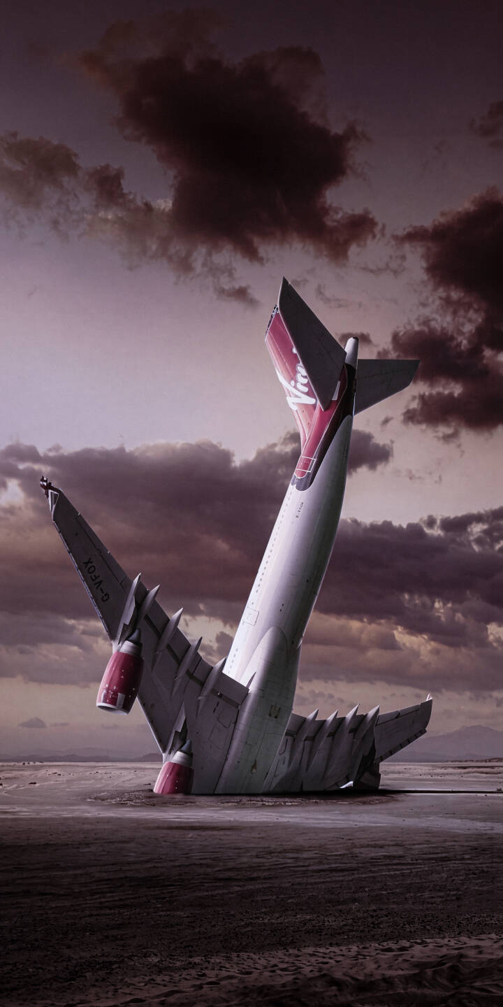 The dramatic tail section of a crashed airplane juts from the desolate, dark landscape under a moody, overcast sky. This striking 4K airplane wreckage wallpaper offers a unique and powerful visual for your iPhone screen. | dark iphone airplane wallpaper crash mobile aircraft 4k wallpaper hd wallpaper surreal dramatic wreckage The dramatic tail section of a crashed airplane juts from the desolate, dark landscape under a moody, overcast sky. This striking 4K airplane wreckage wallpaper offers a unique and powerful visual for your iPhone screen.