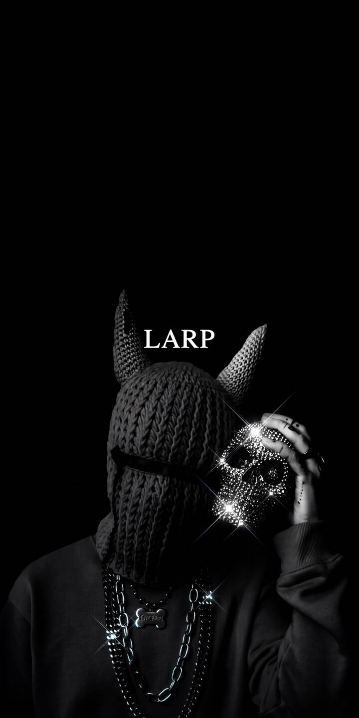 The glittering, studded skull shines brilliantly as a figure in a horned balaclava and heavy chains holds it up against a dark background in this atmospheric 4K wallpaper. This captivating LARP aesthetic wallpaper is perfect for personalizing your iPhone. | aesthetic dark skull iphone wallpaper mobile 4k wallpaper hd wallpaper horns streetwear balaclava larp The glittering, studded skull shines brilliantly as a figure in a horned balaclava and heavy chains holds it up against a dark background in this atmospheric 4K wallpaper. This captivating LARP aesthetic wallpaper is perfect for personalizing your iPhone.