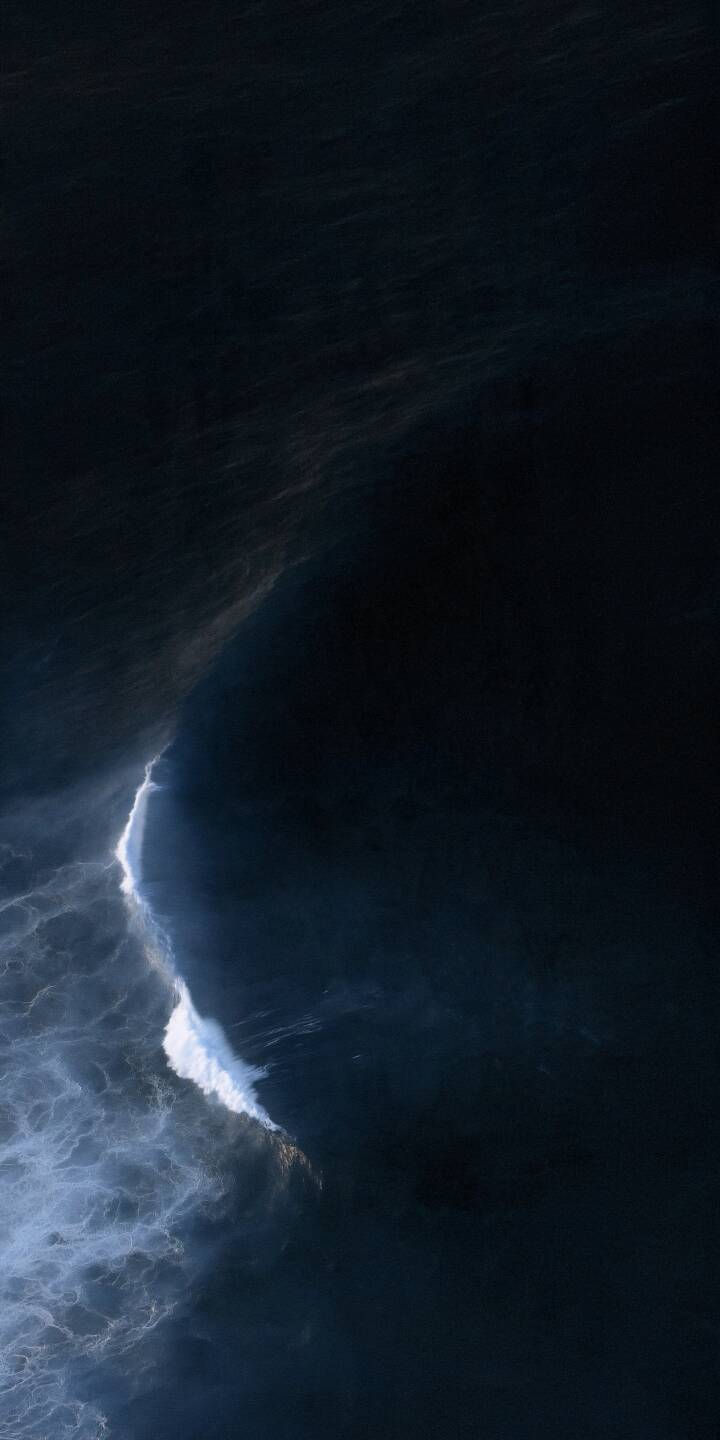 A powerful ocean wave curls through the deep blue sea, leaving a delicate trail of white foam against the dark water. Captured from above, the dramatic contrast between shadow and movement creates a mysterious, peaceful, and cinematic ocean atmosphere. | dark sea ocean minimalist waves A powerful ocean wave curls through the deep blue sea, leaving a delicate trail of white foam against the dark water. Captured from above, the dramatic contrast between shadow and movement creates a mysterious, peaceful, and cinematic ocean atmosphere.