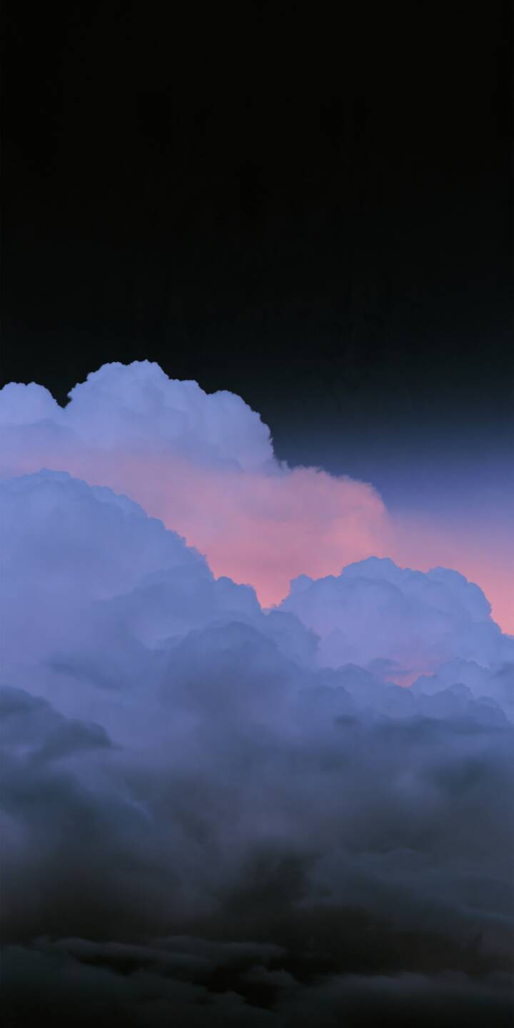Soft lavender and blue clouds drift beneath a vast dark sky, illuminated by delicate pink twilight. The dreamy layers of clouds create a peaceful, mysterious atmosphere, blending soft pastel colors with deep shadows for a cinematic and calming visual experience. | pink purple clouds dreamy cloudscape Soft lavender and blue clouds drift beneath a vast dark sky, illuminated by delicate pink twilight. The dreamy layers of clouds create a peaceful, mysterious atmosphere, blending soft pastel colors with deep shadows for a cinematic and calming visual experience.