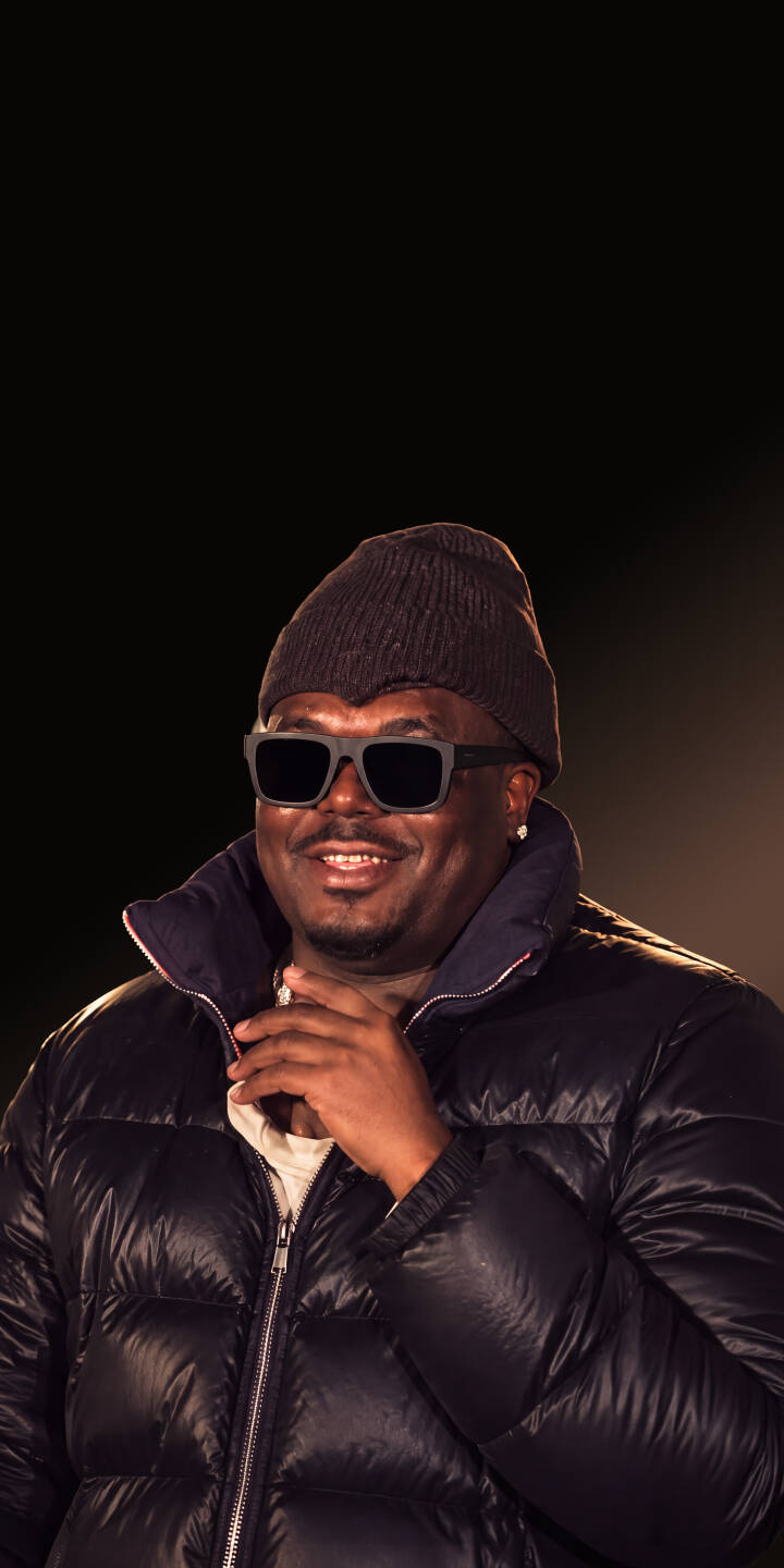 A genuine smile lights up the face of this stylish man, sporting cool dark sunglasses and a warm puffer jacket, making this 4K wallpaper a perfect choice for iPhone users. This unique wallpaper captures a relaxed, urban vibe against a subtle dark background. | man portrait smile sunglasses iphone wallpaper mobile 4k wallpaper hd wallpaper puffer jacket beanie urban aesthetic A genuine smile lights up the face of this stylish man, sporting cool dark sunglasses and a warm puffer jacket, making this 4K wallpaper a perfect choice for iPhone users. This unique wallpaper captures a relaxed, urban vibe against a subtle dark background.