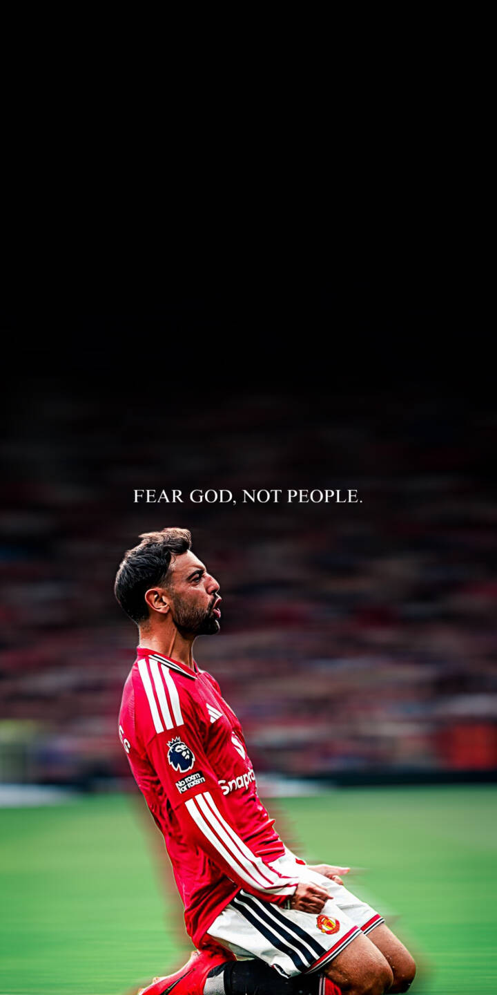 The powerful message "FEAR GOD, NOT PEOPLE." floats above Bruno Fernandes as he kneels solemnly in his iconic red Manchester United kit, looking up with a determined expression in this captivating 4K wallpaper. This stunning wallpaper for iPhone fans captures the intense emotion of the moment, perfect for mobile customization. | football iphone soccer premier league wallpaper mobile manchester united 4k wallpaper hd wallpaper red kit inspirational bruno fernandes The powerful message "FEAR GOD, NOT PEOPLE." floats above Bruno Fernandes as he kneels solemnly in his iconic red Manchester United kit, looking up with a determined expression in this captivating 4K wallpaper. This stunning wallpaper for iPhone fans captures the intense emotion of the moment, perfect for mobile customization.