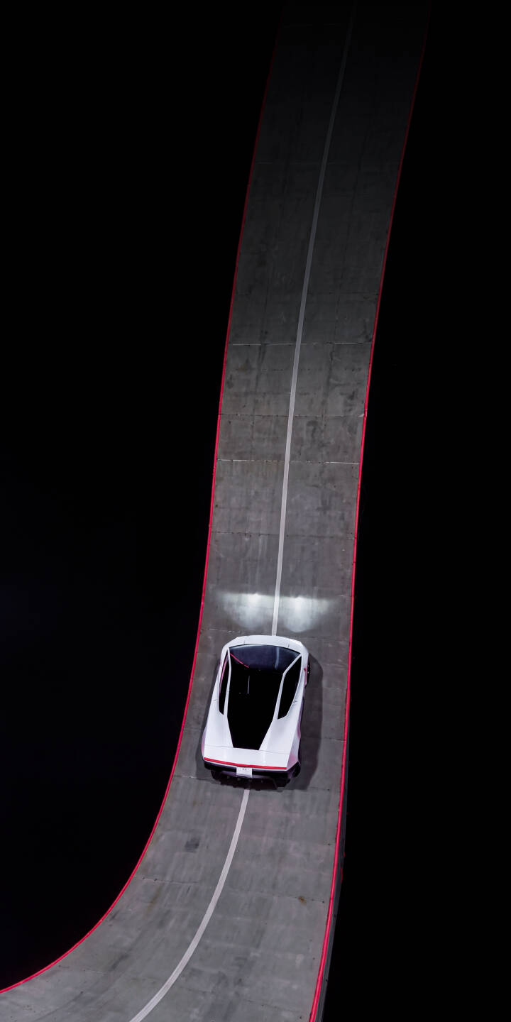 The sleek white futuristic car navigates a dramatic curving track with glowing red edges, its headlights cutting through the dark in this striking 4K wallpaper. This dynamic composition makes an ideal phone wallpaper for iPhone users who appreciate modern design and speed. | night track concept car iphone minimalist wallpaper mobile 4k wallpaper hd wallpaper red neon futuristic car electric vehicle The sleek white futuristic car navigates a dramatic curving track with glowing red edges, its headlights cutting through the dark in this striking 4K wallpaper. This dynamic composition makes an ideal phone wallpaper for iPhone users who appreciate modern design and speed.