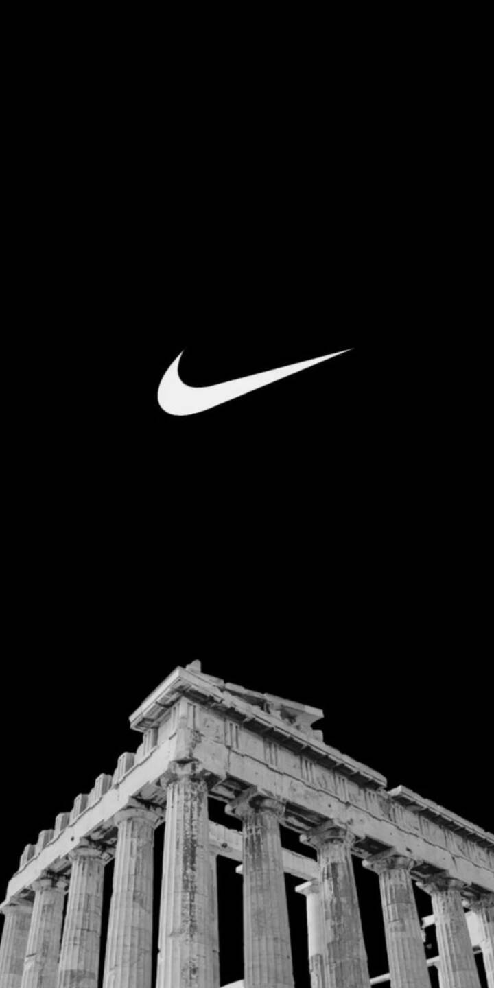 The crisp white Nike swoosh floats gracefully above the stark black silhouette of an ancient Greek temple in this striking 4K wallpaper. This powerful monochromatic contrast creates an inspiring minimalist iPhone wallpaper, perfect for enthusiasts of iconic design and heritage. | dark The crisp white Nike swoosh floats gracefully above the stark black silhouette of an ancient Greek temple in this striking 4K wallpaper. This powerful monochromatic contrast creates an inspiring minimalist iPhone wallpaper, perfect for enthusiasts of iconic design and heritage.