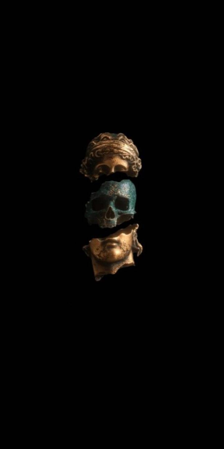 A striking verdigris skull is eerily suspended between golden classical bust fragments, creating a deep visual narrative against the profound black in this captivating 4K wallpaper. This thought-provoking wallpaper, showcasing a blend of ancient art and decay, is an exceptional choice for your iPhone. | dark A striking verdigris skull is eerily suspended between golden classical bust fragments, creating a deep visual narrative against the profound black in this captivating 4K wallpaper. This thought-provoking wallpaper, showcasing a blend of ancient art and decay, is an exceptional choice for your iPhone.