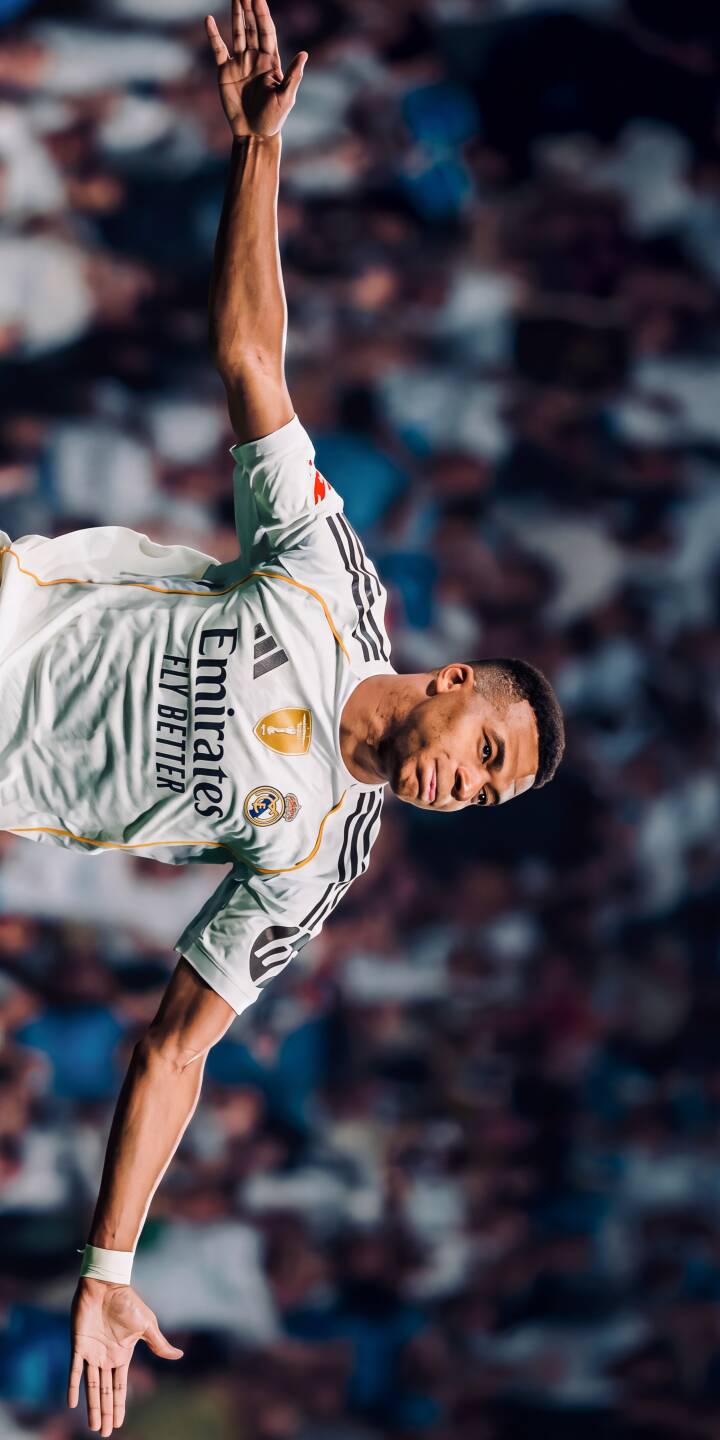 Vinicius Junior celebrates triumphantly with a raised arm in this vibrant 4K wallpaper, capturing his energetic spirit against a blurred stadium backdrop. This stunning wallpaper is perfect for any iPhone, bringing the excitement of Real Madrid to your screen. | sports football player celebration iphone real madrid wallpaper vinicius junior mobile 4k wallpaper hd wallpaper vini jr Vinicius Junior celebrates triumphantly with a raised arm in this vibrant 4K wallpaper, capturing his energetic spirit against a blurred stadium backdrop. This stunning wallpaper is perfect for any iPhone, bringing the excitement of Real Madrid to your screen.