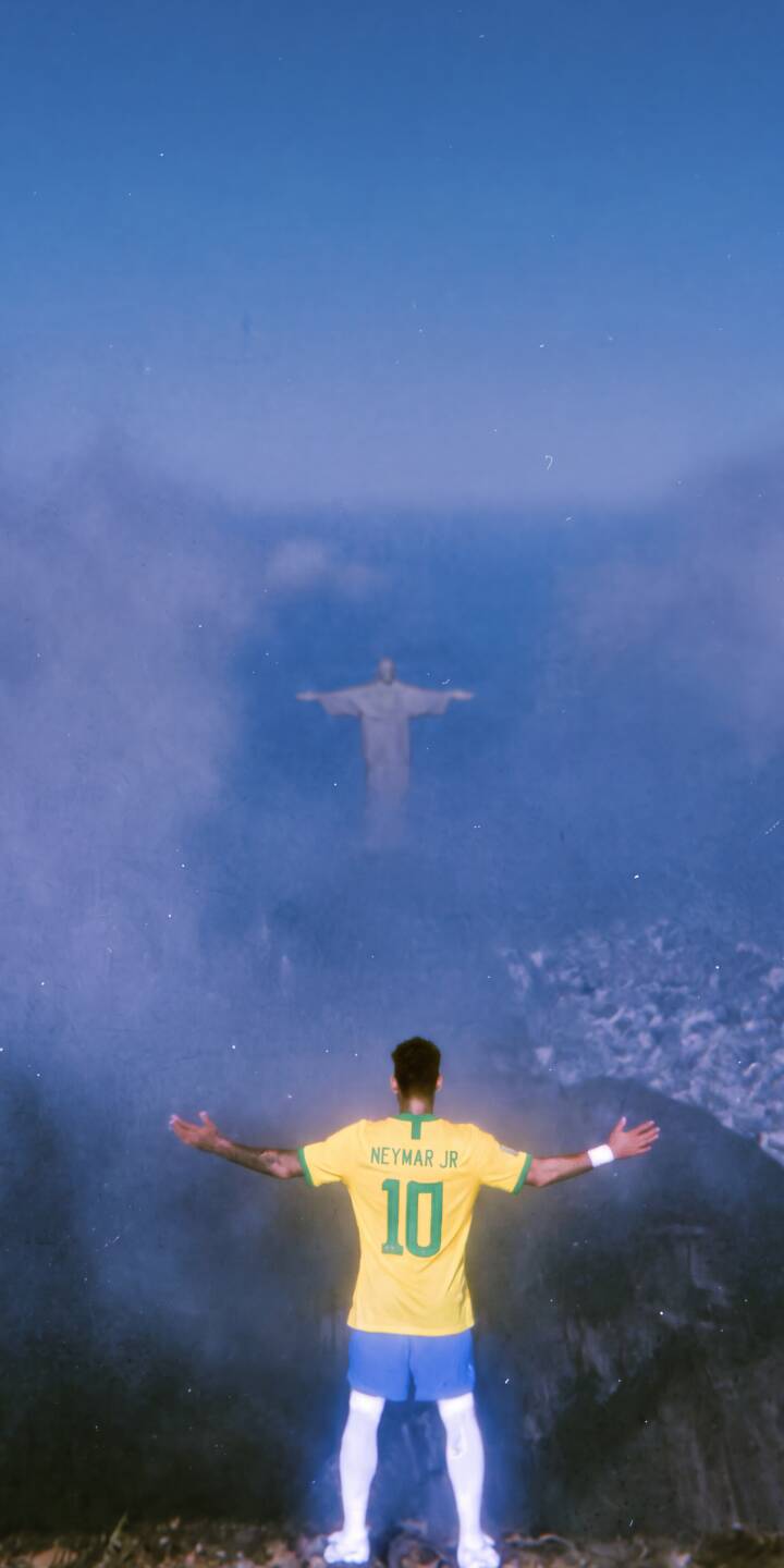 The iconic Christ the Redeemer statue emerges from the mist as Neymar Jr., donning his Brazil jersey, stands with outstretched arms in this stunning 4K wallpaper for iPhone. This inspiring and majestic wallpaper captures a moment of grandeur, perfect for any fan. | football iphone wallpaper brazil neymar mobile 4k wallpaper hd wallpaper iconic majestic neymar jr christ redeemer The iconic Christ the Redeemer statue emerges from the mist as Neymar Jr., donning his Brazil jersey, stands with outstretched arms in this stunning 4K wallpaper for iPhone. This inspiring and majestic wallpaper captures a moment of grandeur, perfect for any fan.