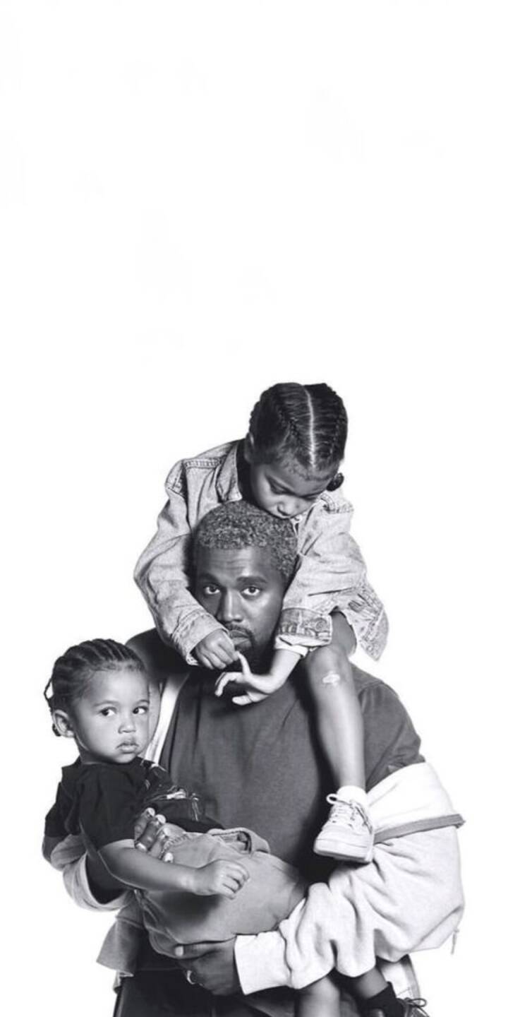 A tender black-and-white moment features Kanye West holding one child while another rests on his shoulders, creating an intimate family 4K wallpaper. This heartwarming wallpaper is perfect for any iPhone, capturing a unique look into his fatherhood. | kanye west A tender black-and-white moment features Kanye West holding one child while another rests on his shoulders, creating an intimate family 4K wallpaper. This heartwarming wallpaper is perfect for any iPhone, capturing a unique look into his fatherhood.
