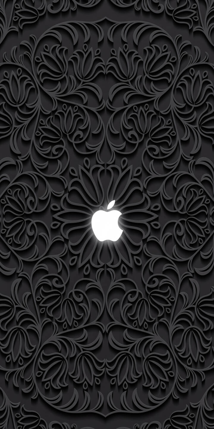 A brilliant white Apple logo glows vibrantly at the center, surrounded by a complex, dark embossed floral pattern that creates a stunning 3D relief effect in this elegant 4K wallpaper. This intricate wallpaper is perfect for personalizing your iPhone with a sophisticated, monochrome aesthetic. | dark apple pattern iphone wallpaper apple logo mobile elegant floral 4k wallpaper hd wallpaper embossed A brilliant white Apple logo glows vibrantly at the center, surrounded by a complex, dark embossed floral pattern that creates a stunning 3D relief effect in this elegant 4K wallpaper. This intricate wallpaper is perfect for personalizing your iPhone with a sophisticated, monochrome aesthetic.