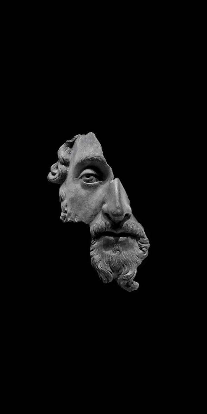 A dramatically fractured classical marble bust with a detailed beard and intense eye emerges from a deep black background, creating a minimalist yet powerful 4K wallpaper. This stunning ancient sculpture wallpaper for iPhone captures a unique blend of history and modern aesthetic. | art A dramatically fractured classical marble bust with a detailed beard and intense eye emerges from a deep black background, creating a minimalist yet powerful 4K wallpaper. This stunning ancient sculpture wallpaper for iPhone captures a unique blend of history and modern aesthetic.