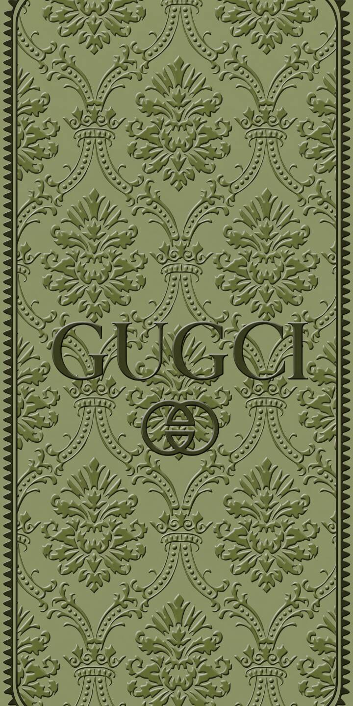 A sophisticated embossed damask pattern in muted olive green provides a luxurious backdrop for the iconic GUCCI text and interlocking G logo in this 4K wallpaper. This elegant wallpaper makes a perfect statement piece for your iPhone. | aesthetic green brand pattern iphone luxury wallpaper gucci mobile 4k wallpaper hd wallpaper damask A sophisticated embossed damask pattern in muted olive green provides a luxurious backdrop for the iconic GUCCI text and interlocking G logo in this 4K wallpaper. This elegant wallpaper makes a perfect statement piece for your iPhone.