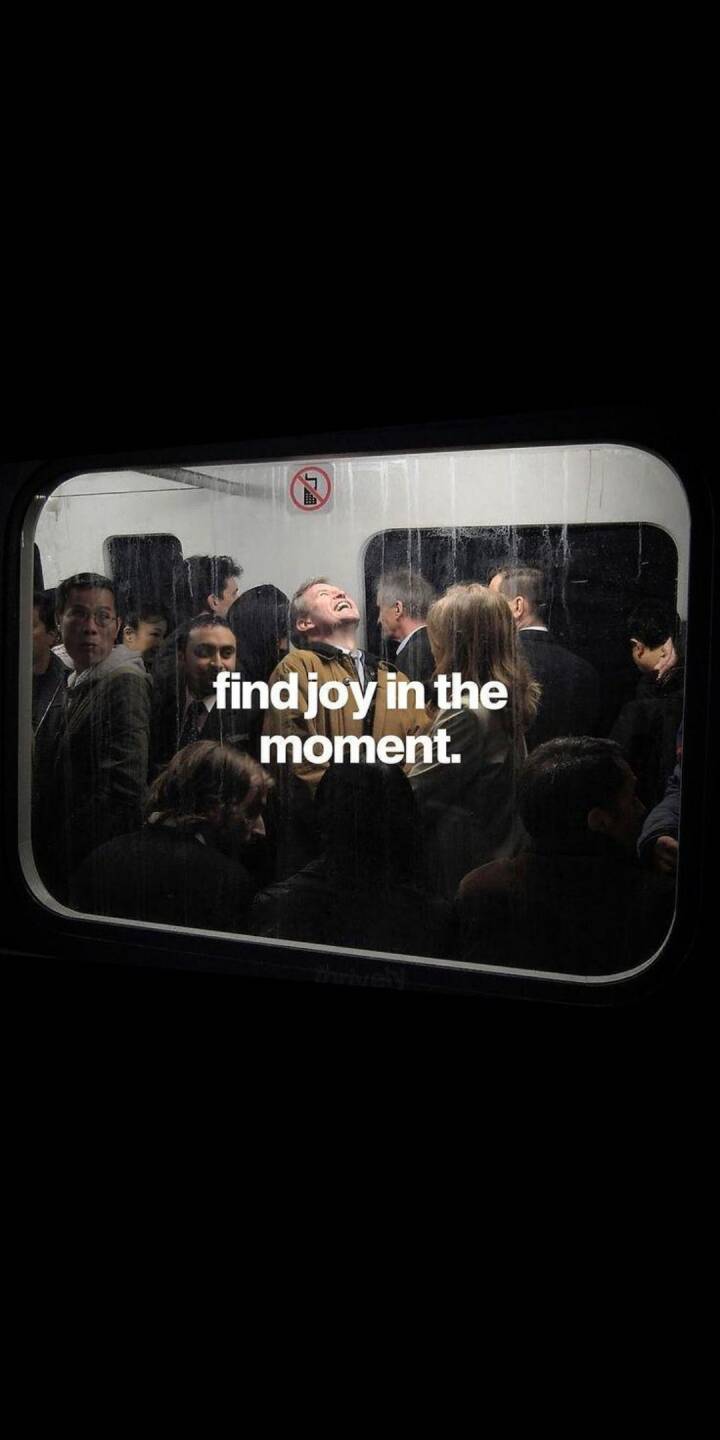 A man's genuine laughter fills the dimly lit train car, captured with the poignant message 'find joy in the moment' on the window pane, creating an uplifting 4K wallpaper. This atmospheric urban commute scene makes a perfect wallpaper for your iPhone. | artist A man's genuine laughter fills the dimly lit train car, captured with the poignant message 'find joy in the moment' on the window pane, creating an uplifting 4K wallpaper. This atmospheric urban commute scene makes a perfect wallpaper for your iPhone.