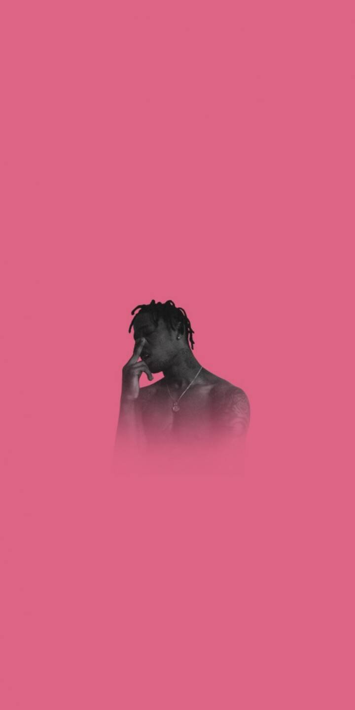 A vibrant pink background highlights Travis Scott's monochromatic figure in this striking 4K wallpaper, featuring his iconic dreadlocks and a pensive hand-to-face pose, an ideal wallpaper for any iPhone. This unique aesthetic creates a captivating look for your device. | artist A vibrant pink background highlights Travis Scott's monochromatic figure in this striking 4K wallpaper, featuring his iconic dreadlocks and a pensive hand-to-face pose, an ideal wallpaper for any iPhone. This unique aesthetic creates a captivating look for your device.