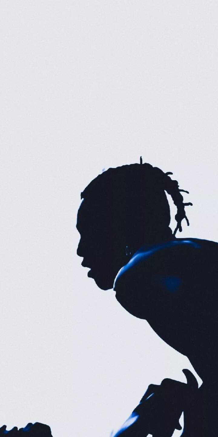 A striking dark silhouette of Travis Scott with subtle blue highlights takes center stage against a clean white background in this minimalist 4K wallpaper. This powerful wallpaper is a perfect fit for iPhone users seeking an iconic and artistic mobile display. | artist A striking dark silhouette of Travis Scott with subtle blue highlights takes center stage against a clean white background in this minimalist 4K wallpaper. This powerful wallpaper is a perfect fit for iPhone users seeking an iconic and artistic mobile display.